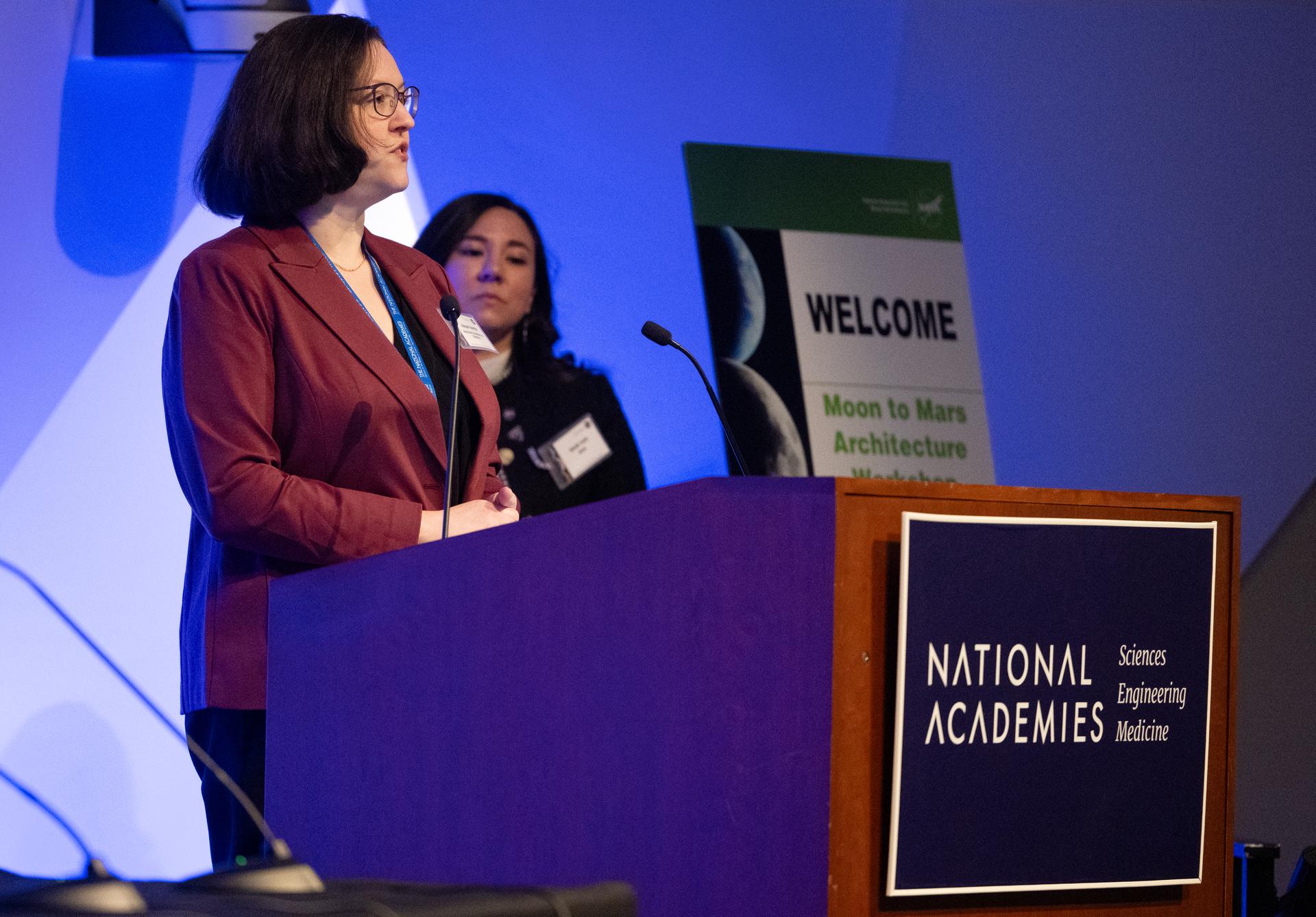 Abigail Sheffer, senior program office for Aeronautics, Space, and Astronomy at the National Academy of Sciences speaks at the Moon to Mars Architecture Workshop, Wednesday, Jan. 21, 2026, at the National Academy of Sciences in Washington. NASA held the workshop to engage the broader space community and collect feedback from U.S. industry and academia and international partners to inform NASA's Moon to Mars Architecture, the agency's roadmap for human exploration of the Moon and Mars. Photo Credit: (NASA/Joel Kowsky)
