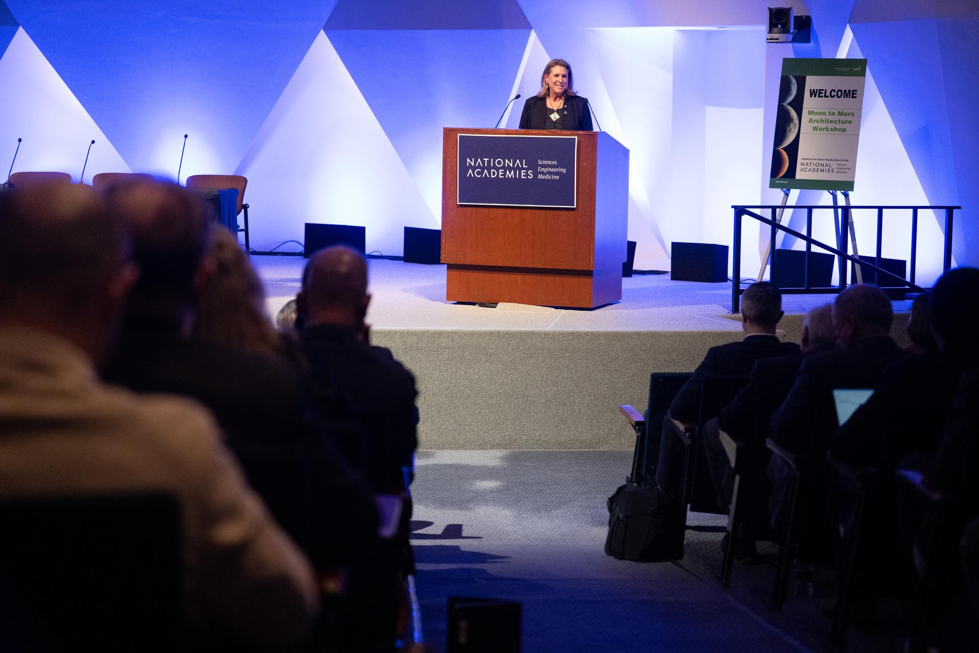Lori Glaze, acting associate administrator for NASA's Exploration Systems Development Mission Directorate, gives opening remarks at the Moon to Mars Architecture Workshop, Wednesday, Jan. 21, 2026, at the National Academy of Sciences in Washington. NASA held the workshop to engage the broader space community and collect feedback from U.S. industry and academia and international partners to inform NASA's Moon to Mars Architecture, the agency's roadmap for human exploration of the Moon and Mars. Photo Credit: (NASA/Joel Kowsky)
