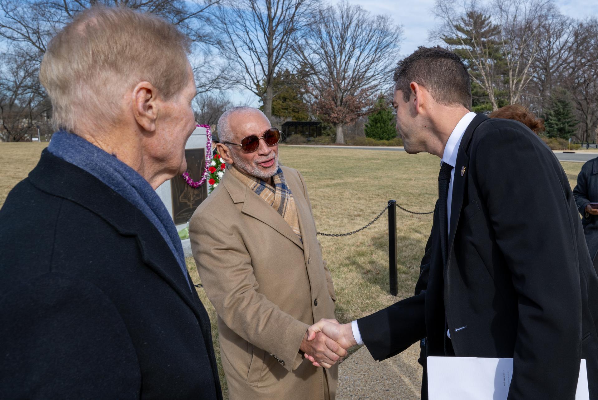 NASA Administrator Jared Isaacman, right, greets former NASA Administrator Charles Bolden, center, following a wreath laying ceremony as part of NASA's Day of Remembrance, Thursday, Jan. 22, 2026, at Arlington National Cemetery in Arlington, Va. Wreaths were laid in memory of those men and women who lost their lives in the quest for space exploration. Photo Credit: (NASA/Keegan Barber)