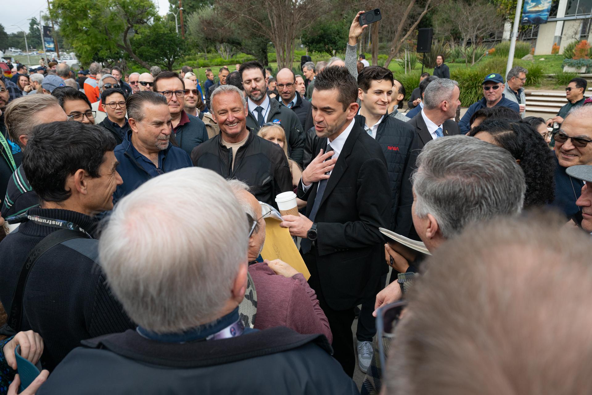 NASA Administrator Jared Isaacman, center, greets members of the workforce, Saturday, Jan. 24, 2026, at NASA’s Jet Propulsion Laboratory (JPL) in Pasadena, Calif. JPL marks the eighth stop in Isaacman’s roadshow to visit NASA facilities and engage directly with the agency’s workforce. Photo Credit: (NASA/John Kraus)