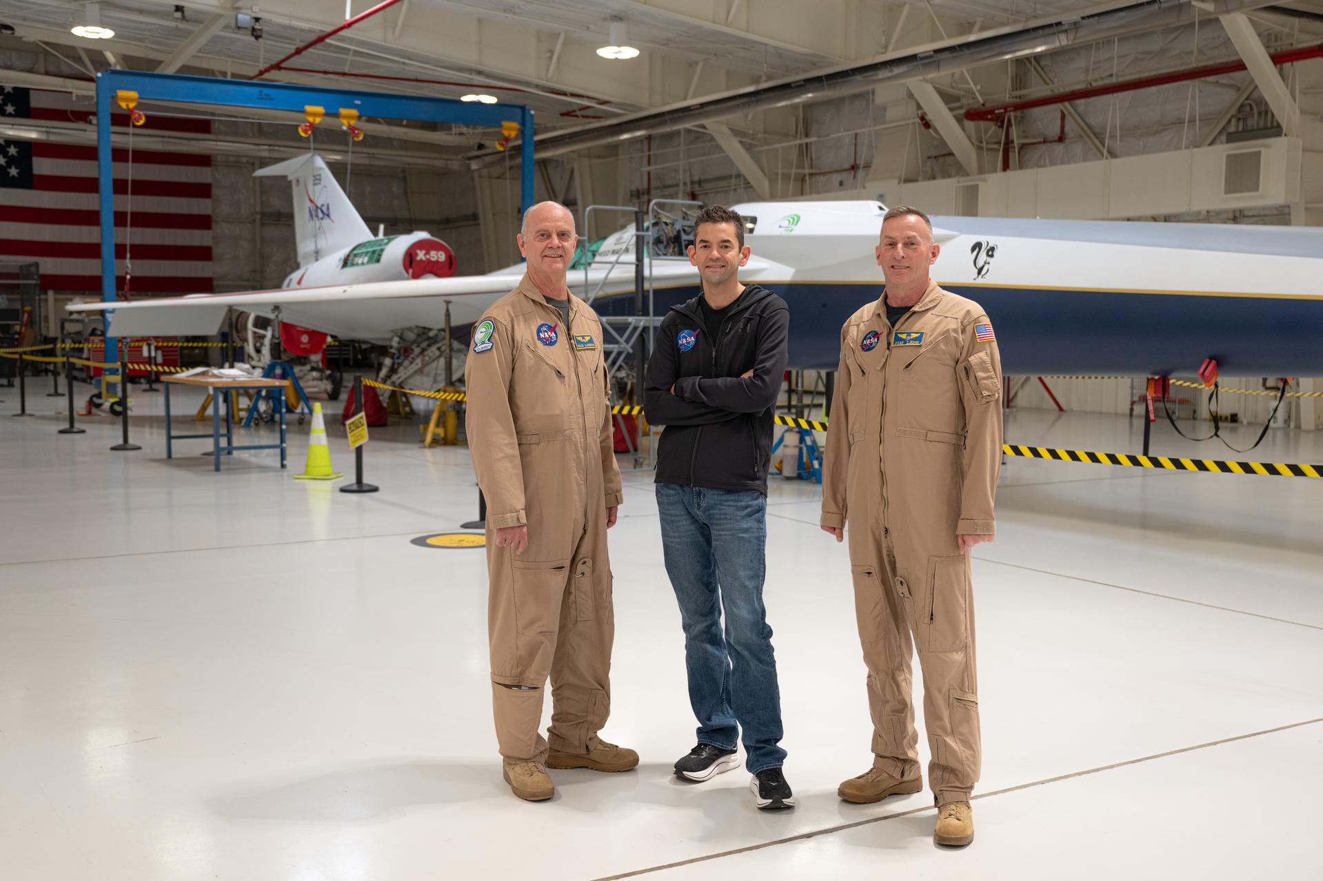 NASA Administrator Jared Isaacman, center, and NASA pilots Nils Larson, left, and Jim Less, right, pose for a photograph with the X-59 aircraft, Sunday, Jan. 25, 2026, at NASA’s Armstrong Flight Research Center at Edwards Air Force Base in California. Armstrong marks the ninth stop in Isaacman’s roadshow to visit NASA facilities and engage directly with the agency’s workforce. Photo Credit: (NASA/John Kraus)
