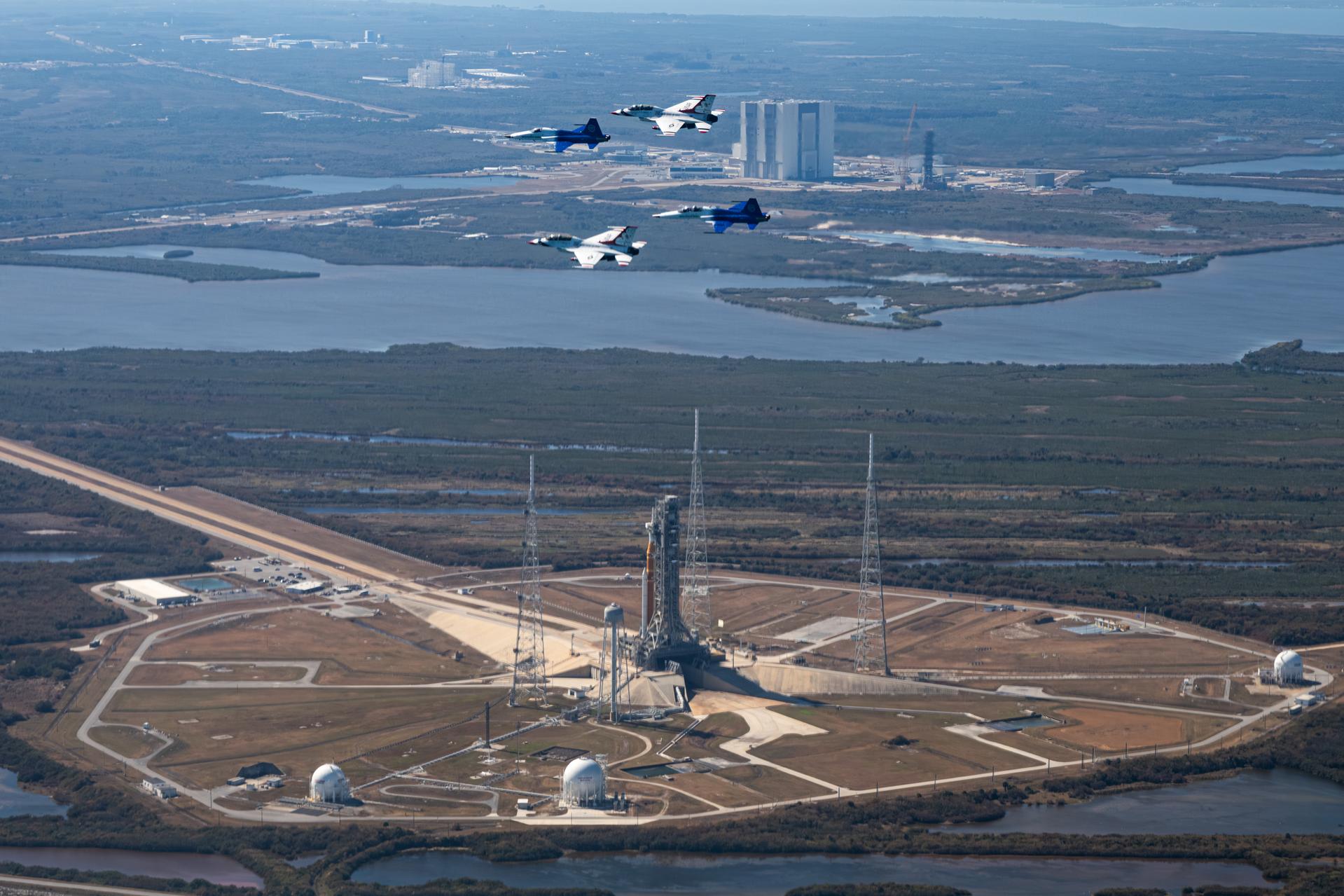 NASA Administrator Jared Isaacman conducts a formation flight with two of his personal F-5 aircraft, piloted by Isaacman and Sean Gustafson, senior advisor to the administrator, and two U.S. Air Force Thunderbirds F-16s, piloted by Thunderbird 7 Lt. Col. Tyler Keener and Thunderbird 8 Maj. Samuel Larson, Sunday, Feb. 8, 2026, at NASA’s Kennedy Space Center in Florida. The formation flew near the Artemis II SLS (Space Launch System) rocket and Orion spacecraft at Launch Complex 39B and the surrounding area at Kennedy. Photo Credit: (NASA/John Kraus)
