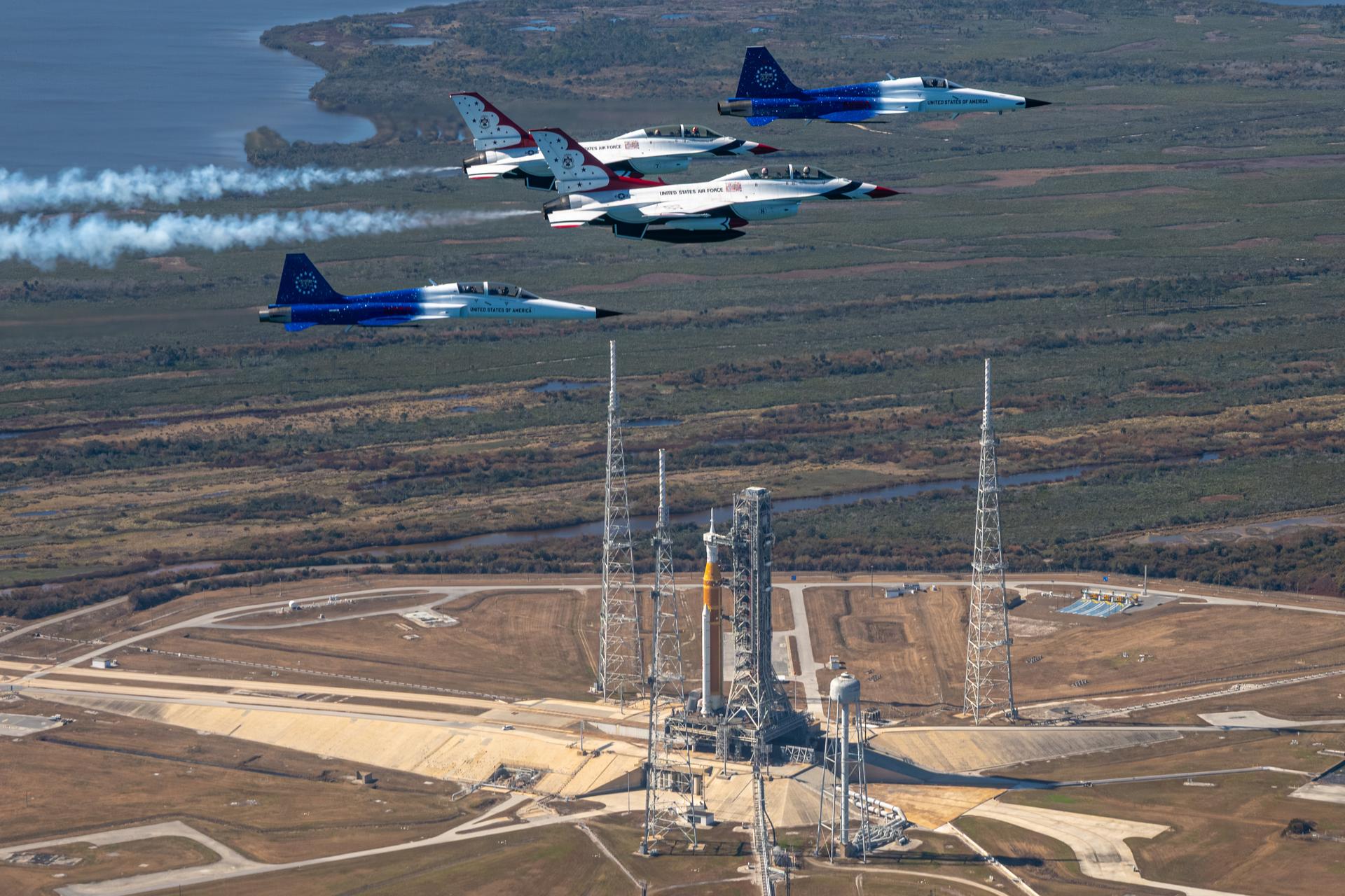 NASA Administrator Jared Isaacman conducts a formation flight with two of his personal F-5 aircraft, piloted by Isaacman and Sean Gustafson, senior advisor to the administrator, and two U.S. Air Force Thunderbirds F-16s, piloted by Thunderbird 7 Lt. Col. Tyler Keener and Thunderbird 8 Maj. Samuel Larson, Sunday, Feb. 8, 2026, at NASA’s Kennedy Space Center in Florida. The formation flew near the Artemis II SLS (Space Launch System) rocket and Orion spacecraft at Launch Complex 39B and the surrounding area at Kennedy. Photo Credit: (NASA/John Kraus)