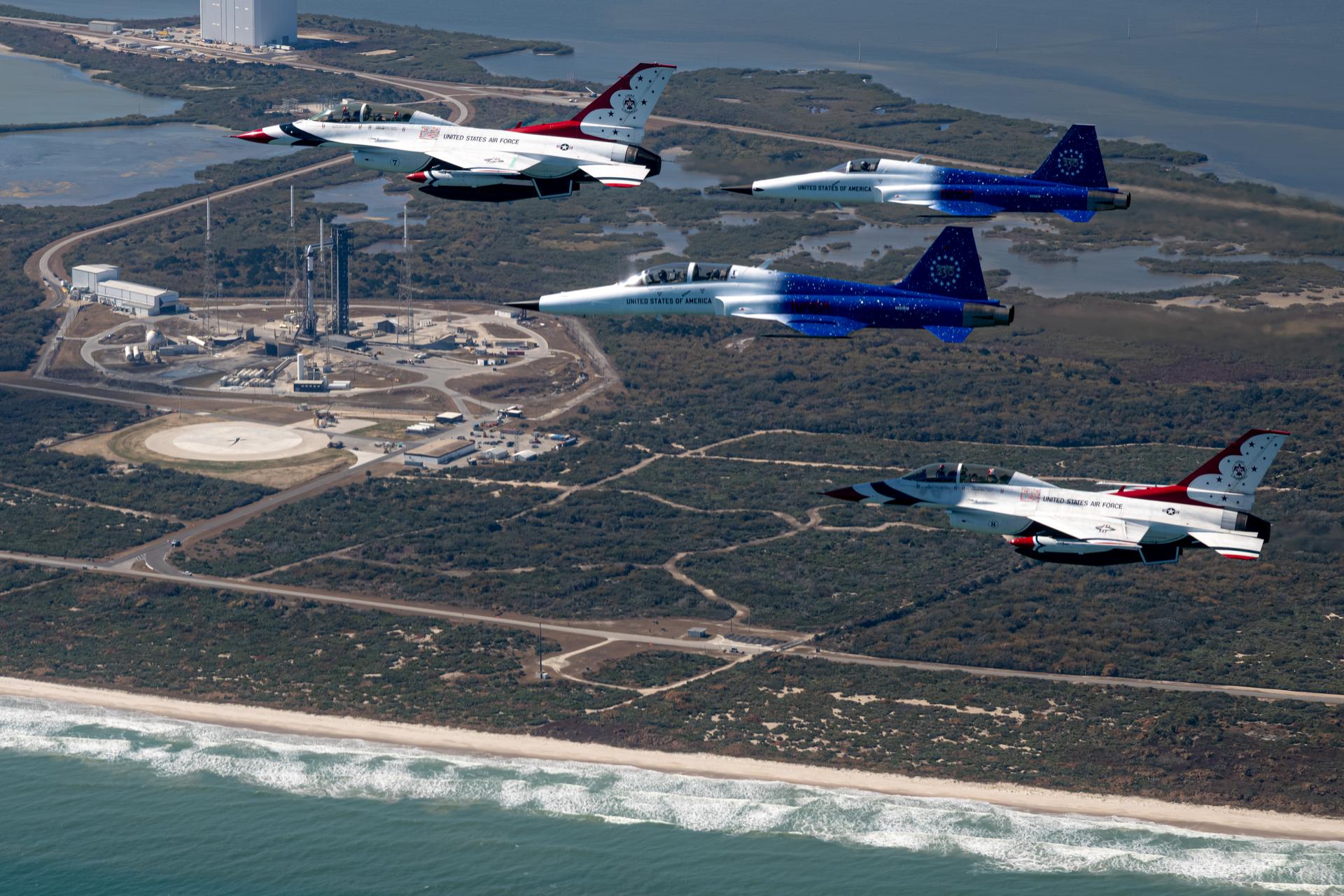 NASA Administrator Jared Isaacman conducts a formation flight with two of his personal F-5 aircraft, piloted by Isaacman and Sean Gustafson, senior advisor to the administrator, and two U.S. Air Force Thunderbirds F-16s, piloted by Thunderbird 7 Lt. Col. Tyler Keener and Thunderbird 8 Maj. Samuel Larson, Sunday, Feb. 8, 2026, at NASA’s Kennedy Space Center in Florida. The formation flew near Space Launch Complex 40 at Cape Canaveral Space Force Station and the surrounding area at Kennedy ahead of Crew-12’s mission to the International Space Station. Photo Credit: (NASA/John Kraus)