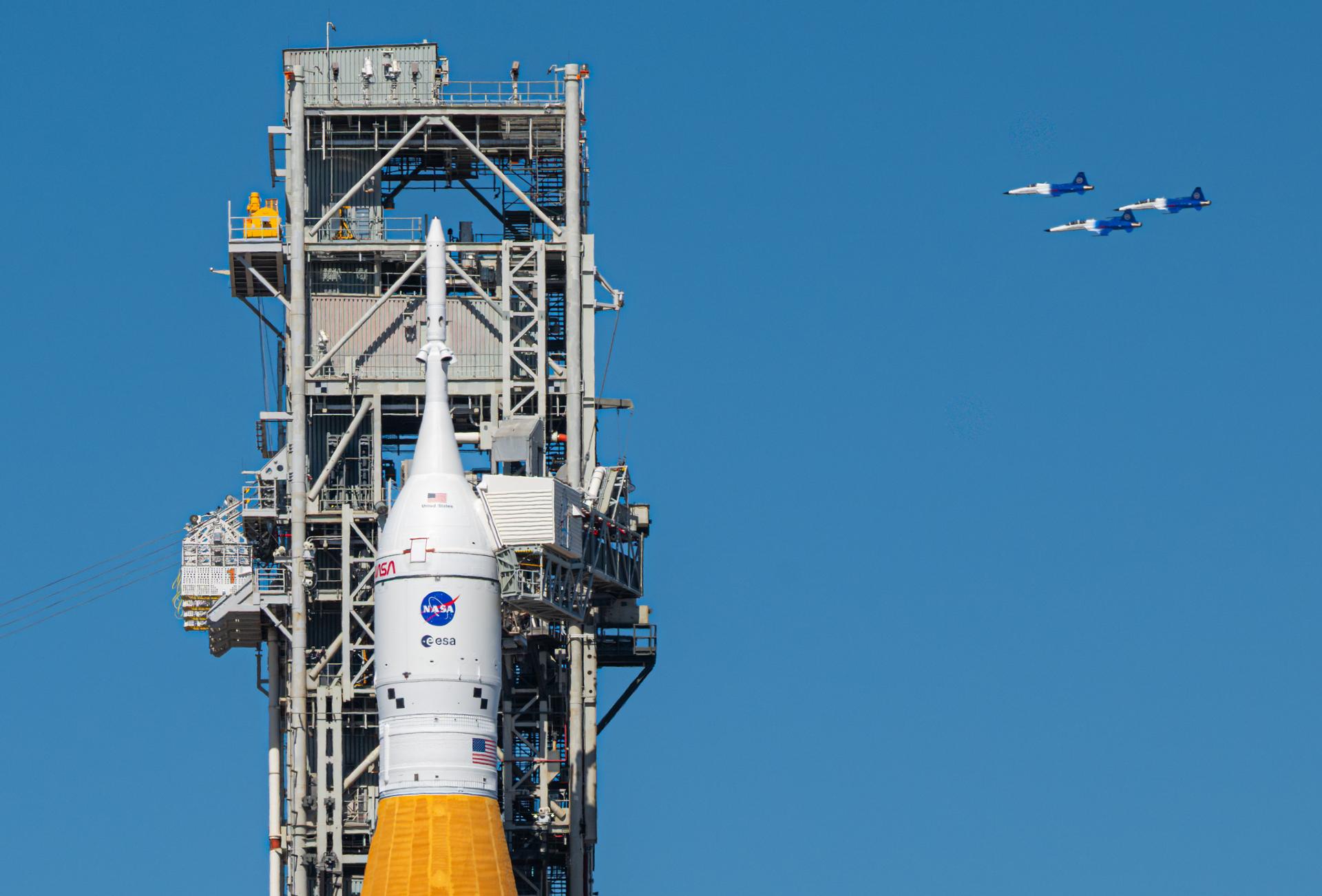 NASA Administrator Jared Isaacman conducts a formation flight with three of his personal F-5 aircraft, Sunday, Feb. 8, 2026, at NASA’s Kennedy Space Center in Florida. The formation flew near the Artemis II SLS (Space Launch System) rocket and Orion spacecraft at Launch Complex 39B and the surrounding area at Kennedy. Photo Credit: (NASA/John Kraus)