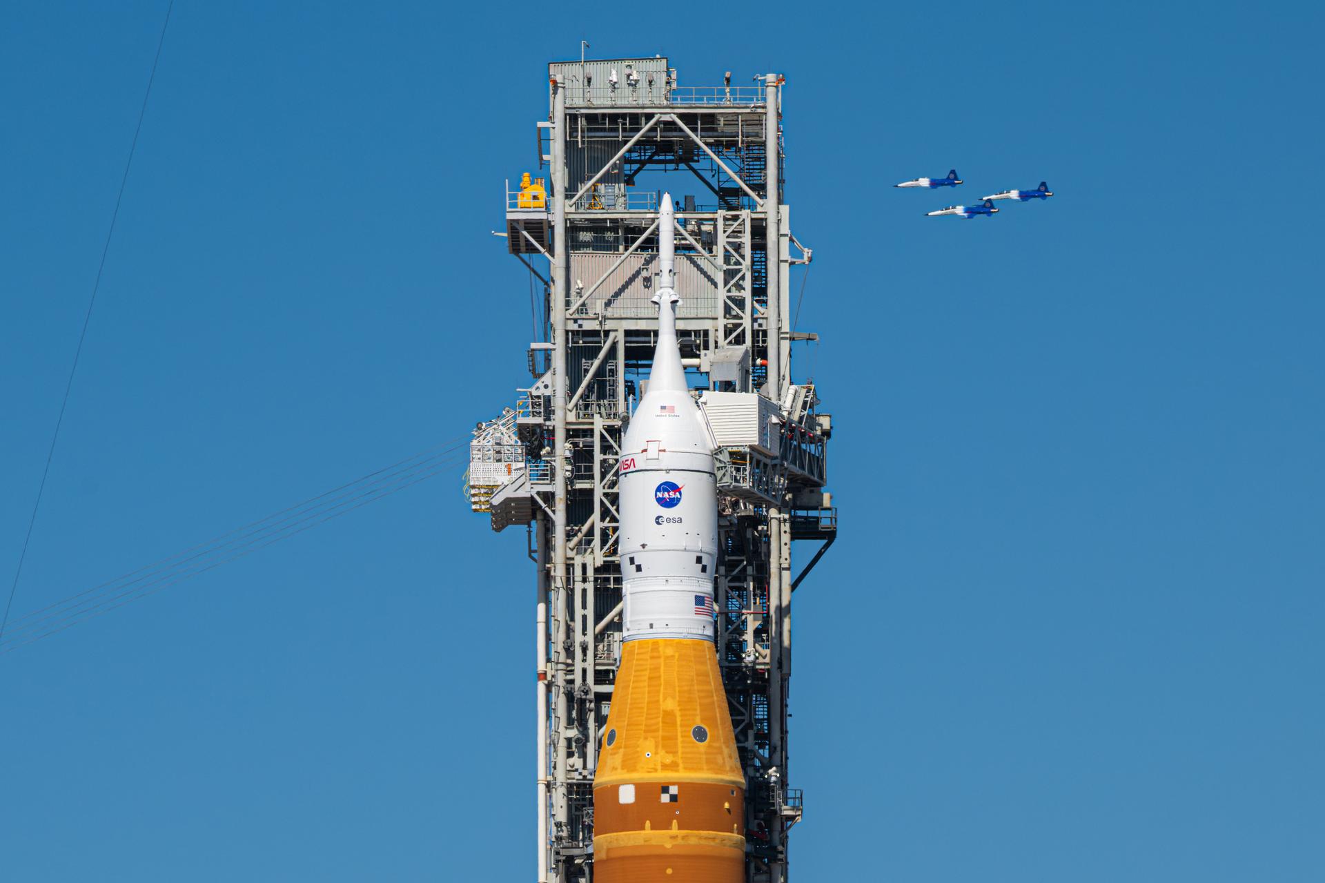 NASA Administrator Jared Isaacman conducts a formation flight with three of his personal F-5 aircraft, Sunday, Feb. 8, 2026, at NASA’s Kennedy Space Center in Florida. The formation flew near the Artemis II SLS (Space Launch System) rocket and Orion spacecraft at Launch Complex 39B and the surrounding area at Kennedy. Photo Credit: (NASA/John Kraus)
