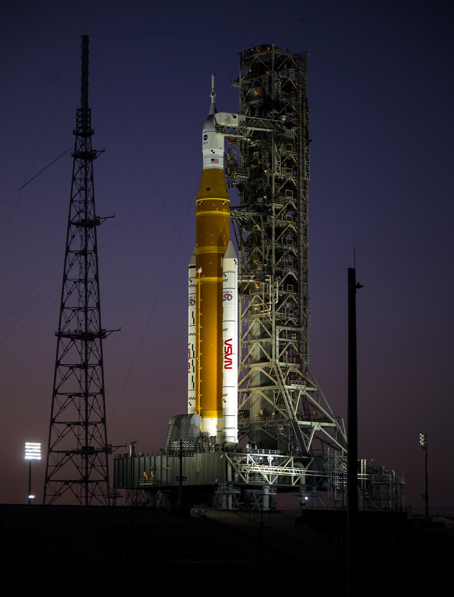NASA’s Artemis II Space Launch System (SLS) rocket and Orion spacecraft are seen illuminated by lights at Launch Complex 39B, Tuesday, Feb. 10, 2026, at NASA’s Kennedy Space Center in Florida. In the coming days, engineers will prepare for the second wet dress rehearsal, a two-day test that simulates launch day. The Artemis II test flight will take Commander Reid Wiseman, Pilot Victor Glover, and Mission Specialist Christina Koch from NASA, and Mission Specialist Jeremy Hansen from the CSA (Canadian Space Agency), around the Moon and back to Earth no later than April 2026. Photo Credit: (NASA/Aubrey Gemignani)