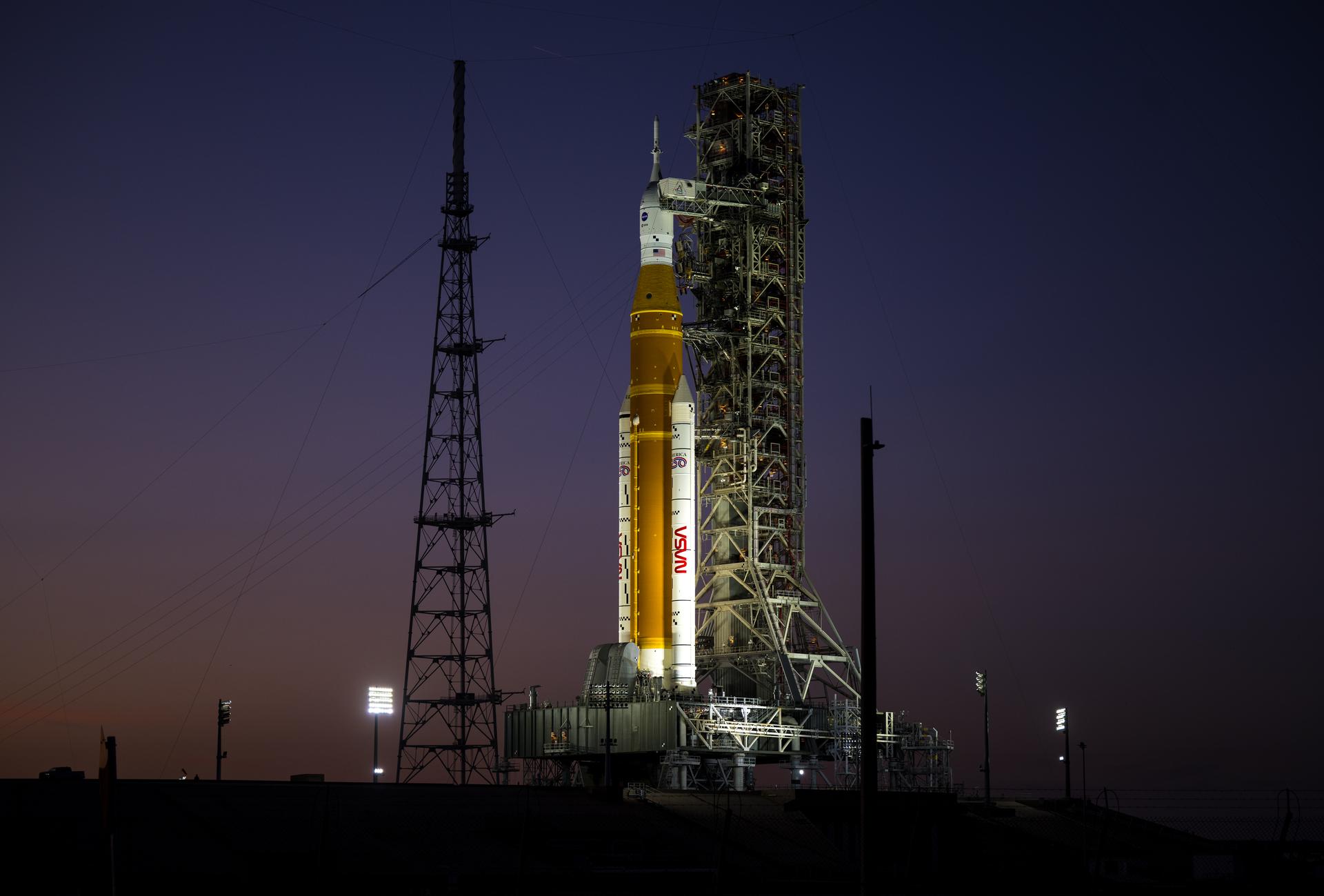 NASA’s Artemis II Space Launch System (SLS) rocket and Orion spacecraft are seen illuminated by lights at Launch Complex 39B, Tuesday, Feb. 10, 2026, at NASA’s Kennedy Space Center in Florida. In the coming days, engineers will prepare for the second wet dress rehearsal, a two-day test that simulates launch day. The Artemis II test flight will take Commander Reid Wiseman, Pilot Victor Glover, and Mission Specialist Christina Koch from NASA, and Mission Specialist Jeremy Hansen from the CSA (Canadian Space Agency), around the Moon and back to Earth no later than April 2026. Photo Credit: (NASA/Aubrey Gemignani)