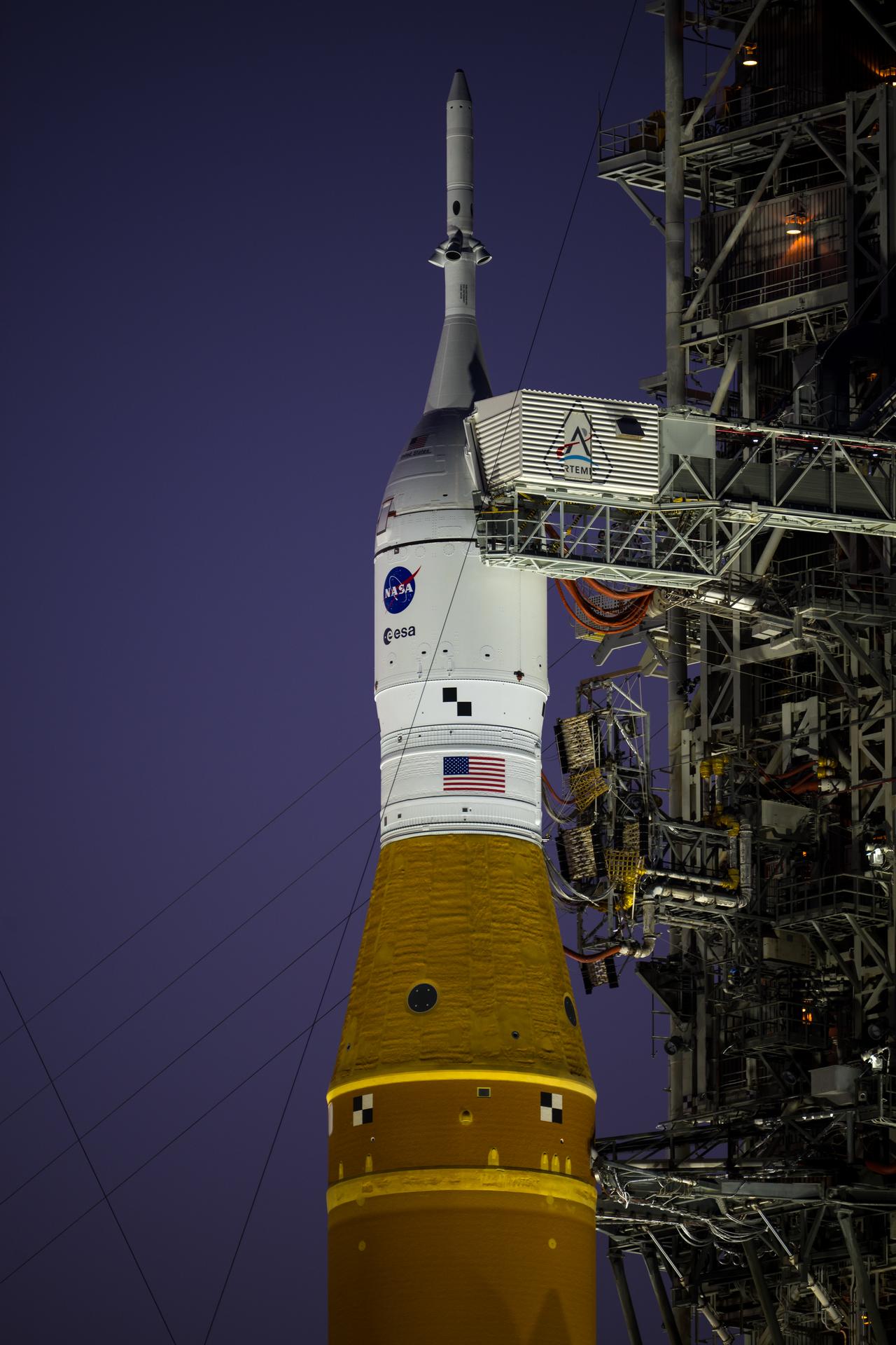NASA’s Artemis II Space Launch System (SLS) rocket and Orion spacecraft are seen illuminated by lights at Launch Complex 39B, Tuesday, Feb. 10, 2026, at NASA’s Kennedy Space Center in Florida. In the coming days, engineers will prepare for the second wet dress rehearsal, a two-day test that simulates launch day. The Artemis II test flight will take Commander Reid Wiseman, Pilot Victor Glover, and Mission Specialist Christina Koch from NASA, and Mission Specialist Jeremy Hansen from the CSA (Canadian Space Agency), around the Moon and back to Earth no later than April 2026. Photo Credit: (NASA/Aubrey Gemignani)