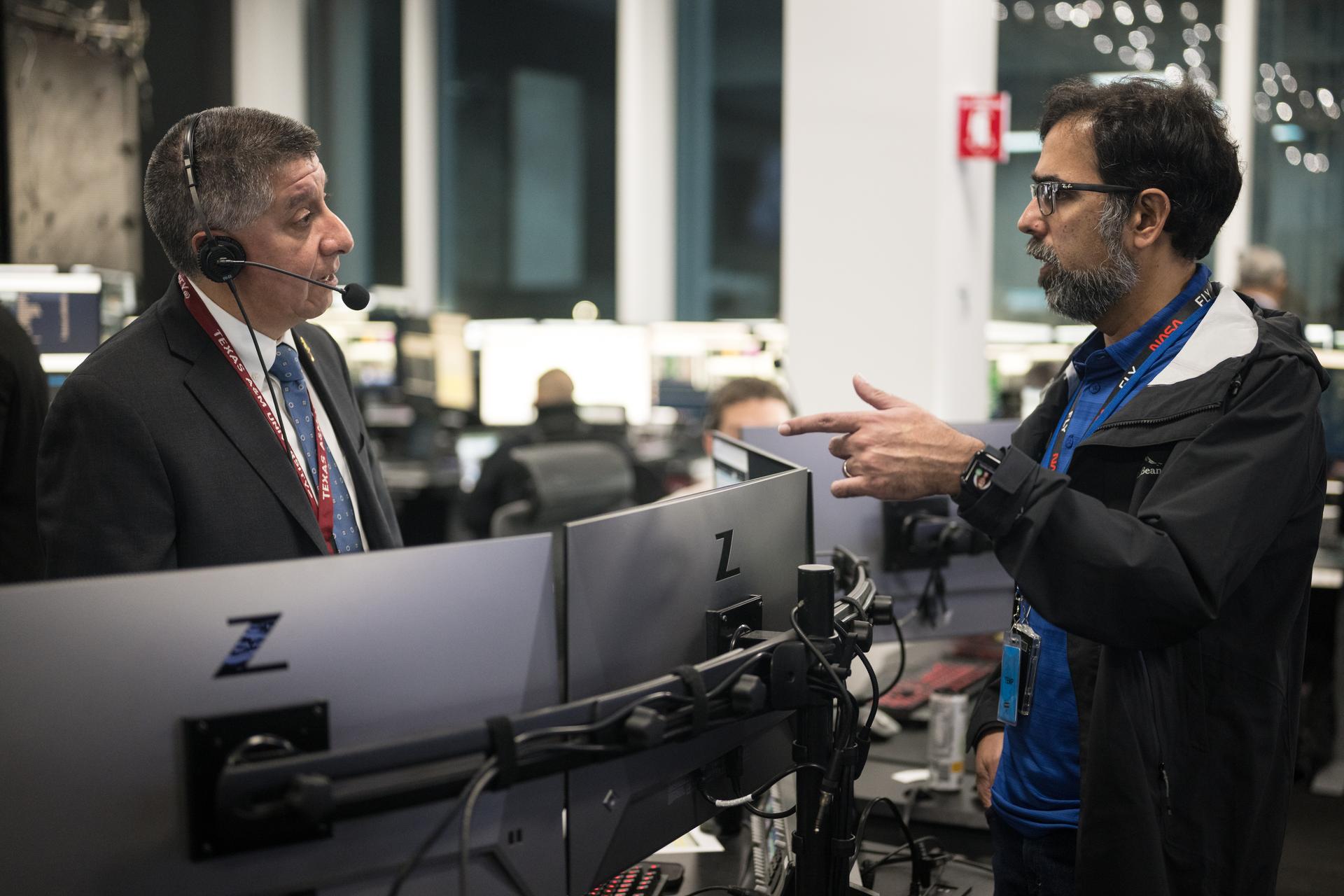 Richard Jones, manager of the Mission Management and Integration Office for NASA's Commercial Crew Program, left, speaks with Amit Kshatriya, NASA Associate Administrator during the countdown of the launch of a SpaceX Falcon 9 rocket carrying the company's Dragon spacecraft on NASA’s SpaceX Crew-12 mission with NASA astronauts Jessica Meir, Jack Hathaway, ESA (European Space Agency) astronaut Sophie Adenot, and Roscosmos cosmonaut Andrey Fedyaev onboard, Friday, Feb. 13, 2026, in the control center of SpaceX’s HangarX at NASA’s Kennedy Space Center in Florida. NASA’s SpaceX Crew-12 mission is the twelfth crew rotation mission of the SpaceX Dragon spacecraft and Falcon 9 rocket to the International Space Station as part of the agency’s Commercial Crew Program. Meir, Hathaway, Adenot, and Fedyaev are scheduled to launch at 5:15 a.m. EST, from Space Launch Complex 40 at the Cape Canaveral Space Force Station. Photo Credit: (NASA/Aubrey Gemignani)