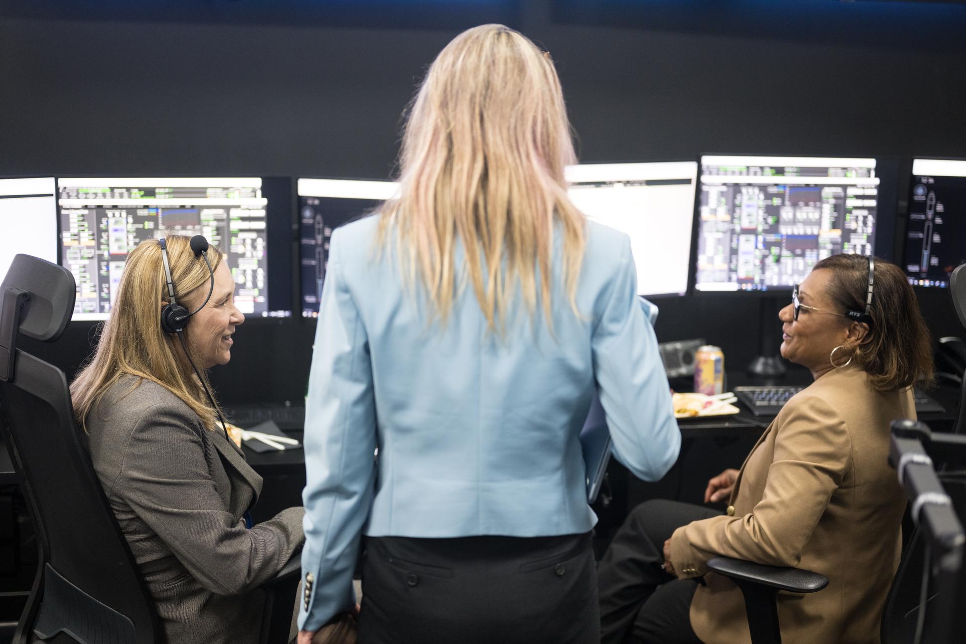 SpaceX-Vice President, Customer Operations and Integration, Jessica Jenson, center, speaks with Janet Petro, director of NASA's Kennedy Space Center, left, and Vanessa Wyche, director of NASA's Johnson Space Center, during the countdown of the launch of a SpaceX Falcon 9 rocket carrying the company's Dragon spacecraft on NASA’s SpaceX Crew-12 mission with NASA astronauts Jessica Meir, Jack Hathaway, ESA (European Space Agency) astronaut Sophie Adenot, and Roscosmos cosmonaut Andrey Fedyaev onboard, Friday, Feb. 13, 2026, in the control center of SpaceX’s HangarX at NASA’s Kennedy Space Center in Florida. NASA’s SpaceX Crew-12 mission is the twelfth crew rotation mission of the SpaceX Dragon spacecraft and Falcon 9 rocket to the International Space Station as part of the agency’s Commercial Crew Program. Meir, Hathaway, Adenot, and Fedyaev are scheduled to launch at 5:15 a.m. EST, from Space Launch Complex 40 at the Cape Canaveral Space Force Station. Photo Credit: (NASA/Aubrey Gemignani)