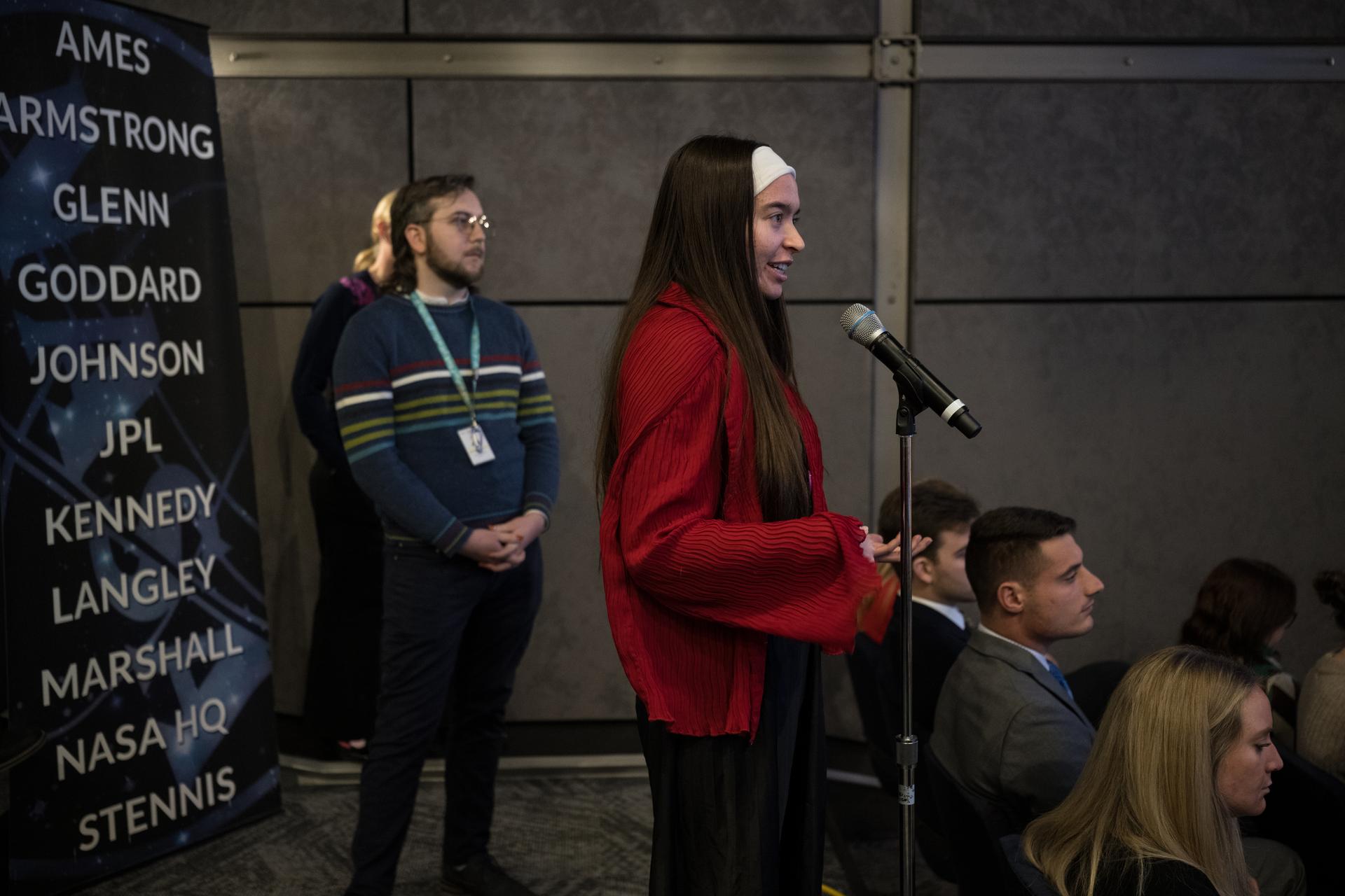 An audience member asks NASA Administrator Jared Isaacman and NASA Associate Administrator Amit Kshatriya a question during a monthly coffee and donuts with the Administrator event, Tuesday, Feb. 24, 2026, at the Mary W. Jackson NASA Headquarters building in Washington. Photo Credit: (NASA/Aubrey Gemignani)