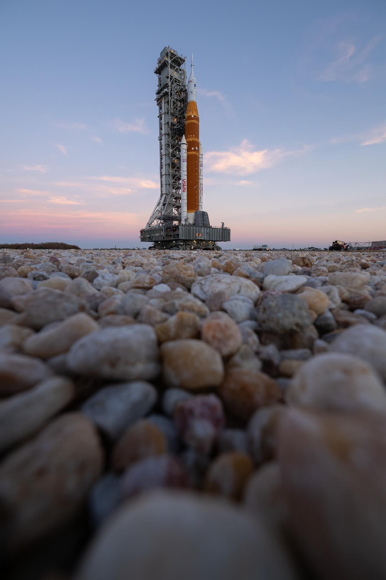 NASA’s Artemis II SLS (Space Launch System) rocket and Orion spacecraft roll back to the Vehicle Assembly Building, Wednesday, Feb. 25, 2026, at NASA’s Kennedy Space Center in Florida. Teams will troubleshoot a helium flow issue experienced on the rocket’s interim cryogenic propulsion stage before rolling the rocket and spacecraft back to Launch Complex 39B for the Artemis II mission around the Moon. Photo Credit: (NASA/John Kraus)