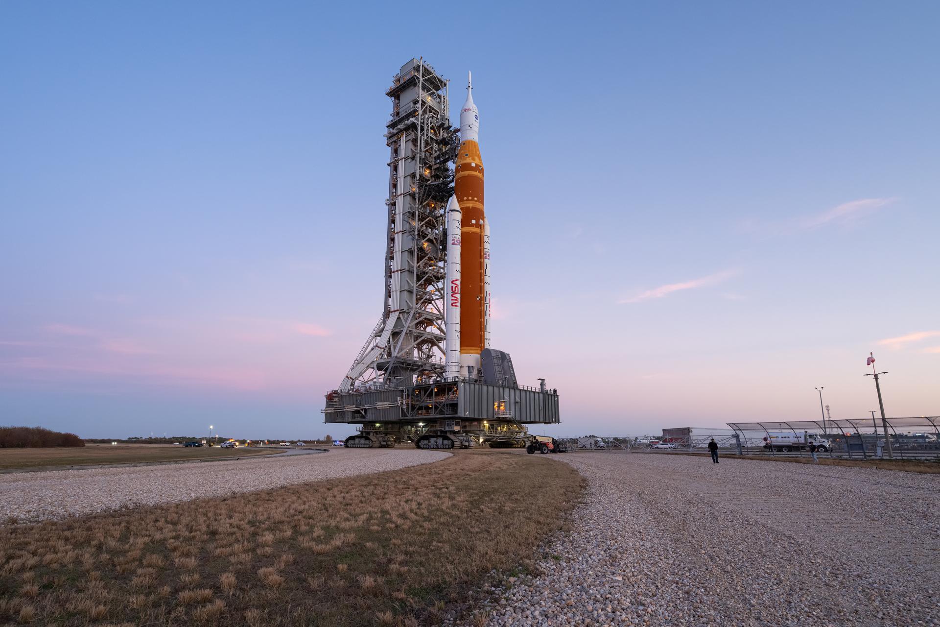 NASA’s Artemis II SLS (Space Launch System) rocket and Orion spacecraft roll back to the Vehicle Assembly Building, Wednesday, Feb. 25, 2026, at NASA’s Kennedy Space Center in Florida. Teams will troubleshoot a helium flow issue experienced on the rocket’s interim cryogenic propulsion stage before rolling the rocket and spacecraft back to Launch Complex 39B for the Artemis II mission around the Moon. Photo Credit: (NASA/John Kraus)
