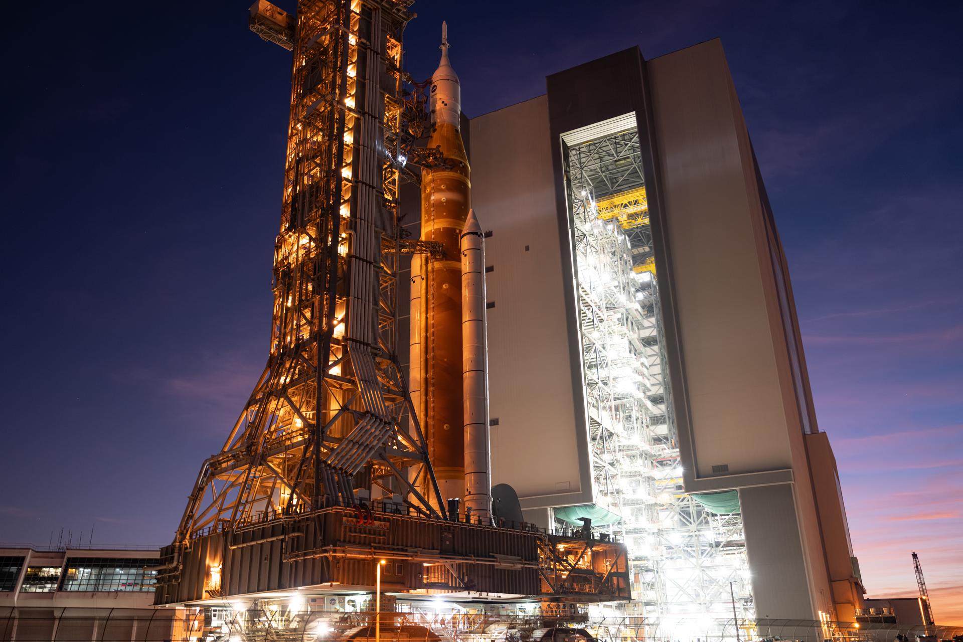 NASA’s Artemis II SLS (Space Launch System) rocket and Orion spacecraft roll back to the Vehicle Assembly Building, Wednesday, Feb. 25, 2026, at NASA’s Kennedy Space Center in Florida. Teams will troubleshoot a helium flow issue experienced on the rocket’s interim cryogenic propulsion stage before rolling the rocket and spacecraft back to Launch Complex 39B for the Artemis II mission around the Moon. Photo Credit: (NASA/John Kraus)