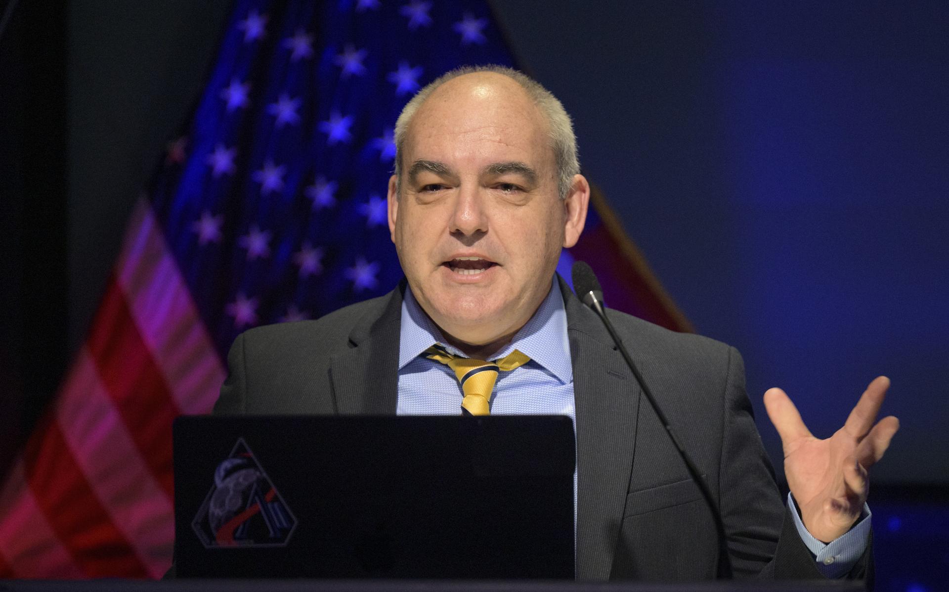 NASA Moon Base Program Executive Carlos Garcia-Galan speaks during an event where NASA is outlining how the agency is executing President Donald J. Trump’s National Space Policy and accelerating preparations for America’s return to the surface of the Moon by 2028, Tuesday, March 24, 2026, at the Mary W. Jackson NASA Headquarters building in Washington. During the event NASA leadership provided updates on mission priorities, including sending the first astronauts to the lunar surface in more than 50 years, establishing the initial elements of a permanent lunar base, getting America underway in space on nuclear propulsion, and other objectives. Photo Credit: (NASA/Bill Ingalls)