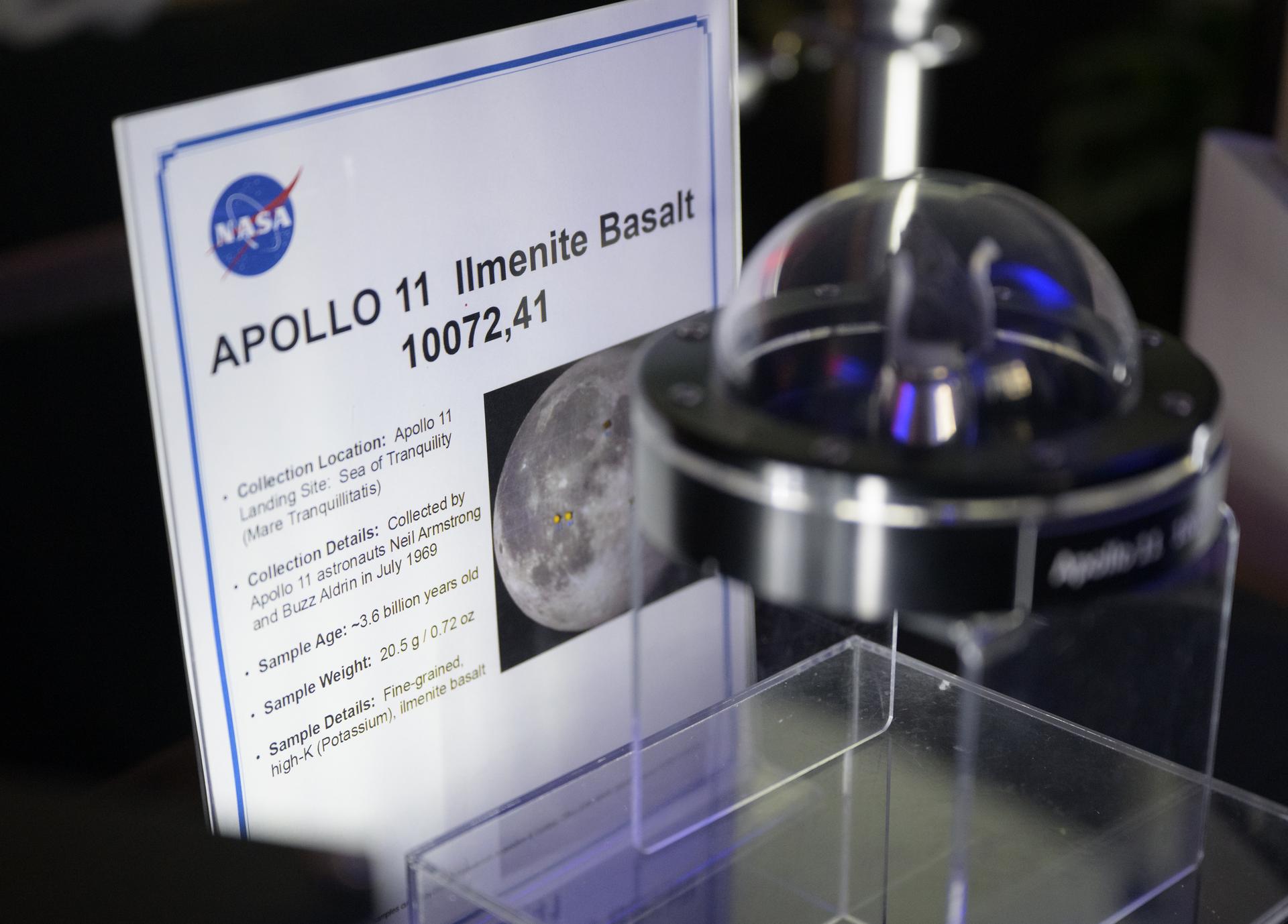 A Moon rock is seen in the NASA Headquarters lobby ahead of an event where NASA outlined how the agency is executing President Donald J. Trump’s National Space Policy and accelerating preparations for America’s return to the surface of the Moon by 2028, Tuesday, March 24, 2026, at the Mary W. Jackson NASA Headquarters building in Washington. During the event NASA leadership provided updates on mission priorities, including sending the first astronauts to the lunar surface in more than 50 years, establishing the initial elements of a permanent lunar base, getting America underway in space on nuclear propulsion, and other objectives. Photo Credit: (NASA/Bill Ingalls)