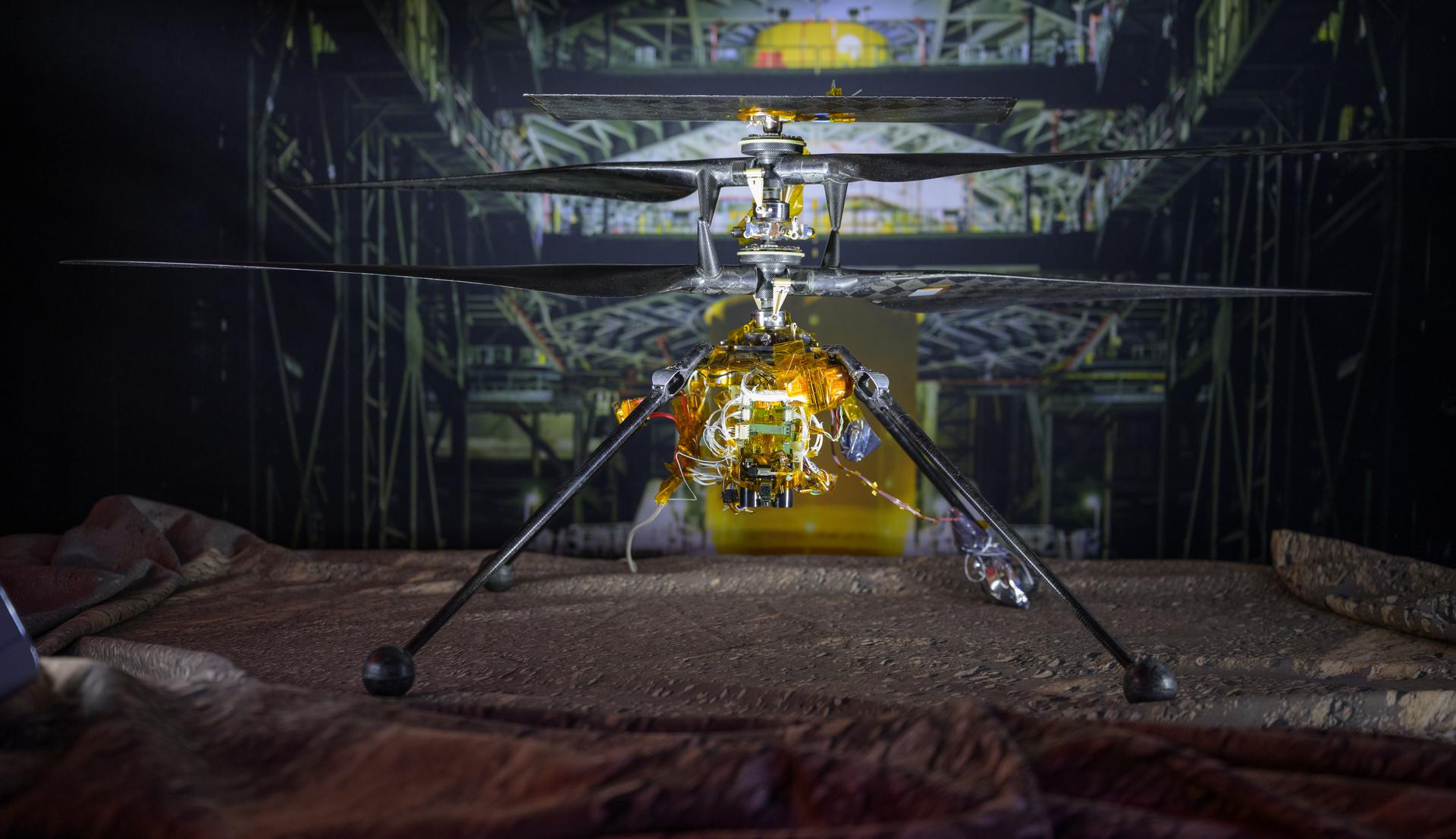 Ingenuity Mars Helicopter, Engineering Design Model 1, is seen on display during an event where NASA is outlining how the agency is executing President Donald J. Trump’s National Space Policy and accelerating preparations for America’s return to the surface of the Moon by 2028, Tuesday, March 24, 2026, at the Mary W. Jackson NASA Headquarters building in Washington. During the event NASA leadership provided updates on mission priorities, including sending the first astronauts to the lunar surface in more than 50 years, establishing the initial elements of a permanent lunar base, getting America underway in space on nuclear propulsion, and other objectives. Photo Credit: (NASA/Bill Ingalls)
