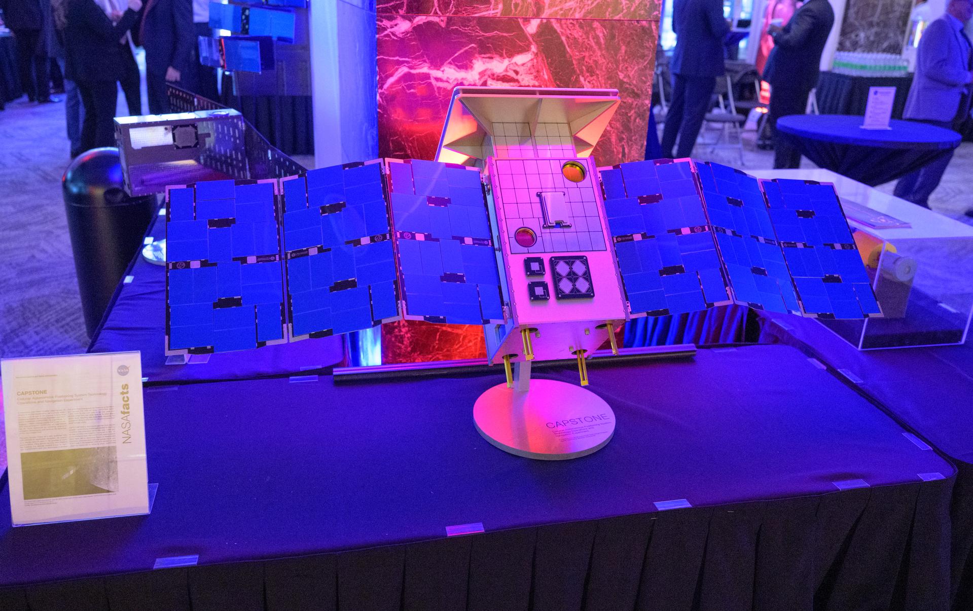 NASA Headquarters lobby is seen with a model of the Cislunar Autonomous Positioning System Technology Operations and Navigation Experiment (CAPSTONE) on display during a 2-day event where NASA outlined how the agency is executing President Donald J. Trump’s National Space Policy and accelerating preparations for America’s return to the surface of the Moon by 2028, Wednesday, March 25, 2026, at the Mary W. Jackson NASA Headquarters building in Washington. During the event NASA leadership provided updates on mission priorities, including sending the first astronauts to the lunar surface in more than 50 years, establishing the initial elements of a permanent lunar base, getting America underway in space on nuclear propulsion, and other objectives. Photo Credit: (NASA/Bill Ingalls)