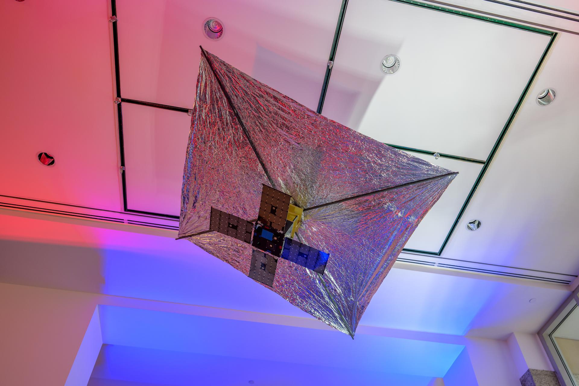A model of the Advanced Composite Solar Sail System (ACS3) is seen in the NASA Headquarters lobby during a 2-day event where NASA outlined how the agency is executing President Donald J. Trump’s National Space Policy and accelerating preparations for America’s return to the surface of the Moon by 2028, Wednesday, March 25, 2026, at the Mary W. Jackson NASA Headquarters building in Washington. During the event NASA leadership provided updates on mission priorities, including sending the first astronauts to the lunar surface in more than 50 years, establishing the initial elements of a permanent lunar base, getting America underway in space on nuclear propulsion, and other objectives. Photo Credit: (NASA/Bill Ingalls)