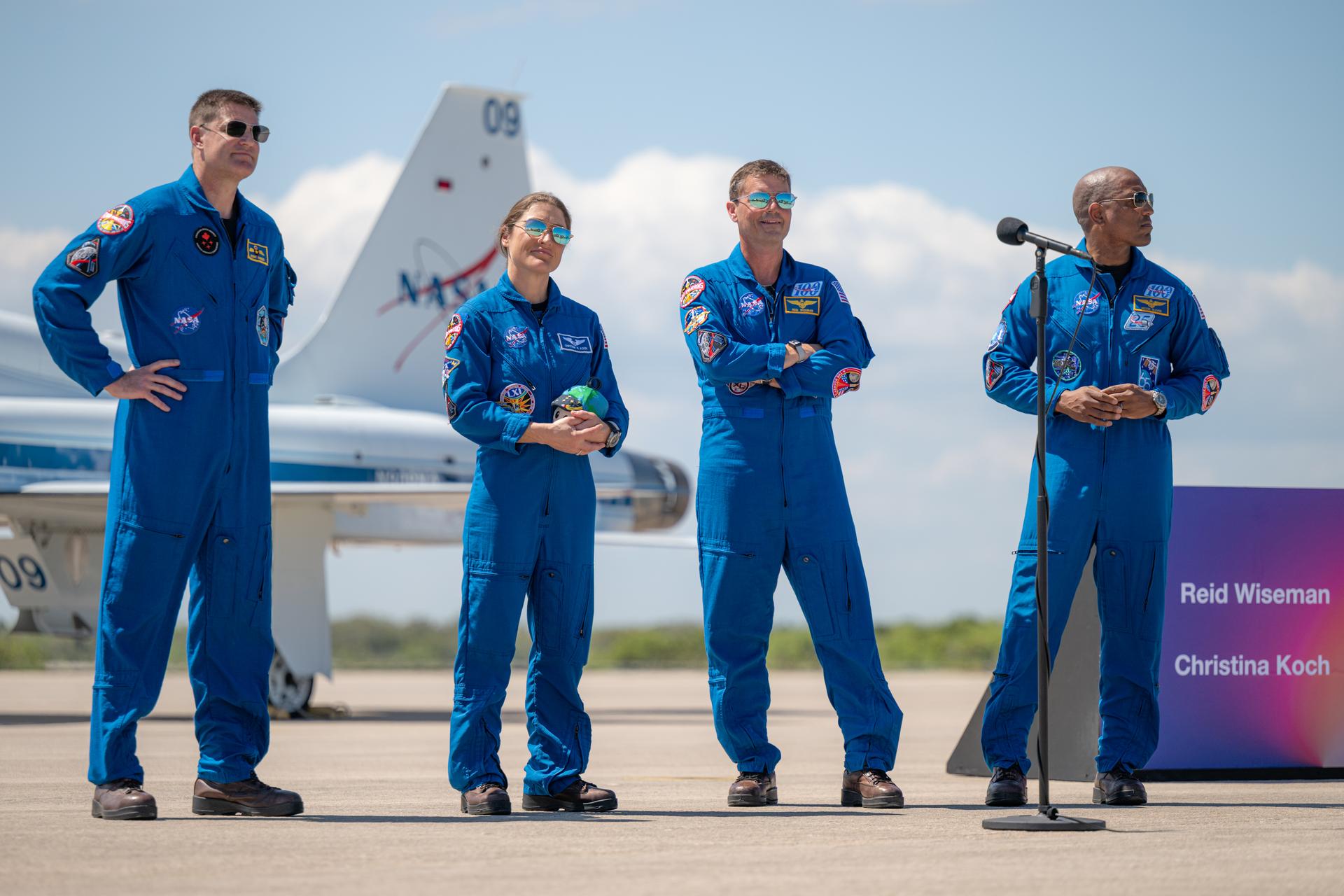 The Artemis II crew of CSA (Canadian Space Agency) astronaut Jeremy Hansen, Artemis II mission specialist; NASA astronaut Christina Koch, Artemis II mission specialist; NASA astronaut Reid Wiseman, Artemis II commander; and NASA astronaut Victor Glover, Artemis II pilot, participate in a press conference, Friday, March 27, 2026, after arriving at the Launch and Landing Facility at NASA’s Kennedy Space Center in Florida. The Artemis II mission will launch the crew on a 10-day journey around the Moon and back no earlier than April 1. Photo Credit: (NASA/John Kraus)