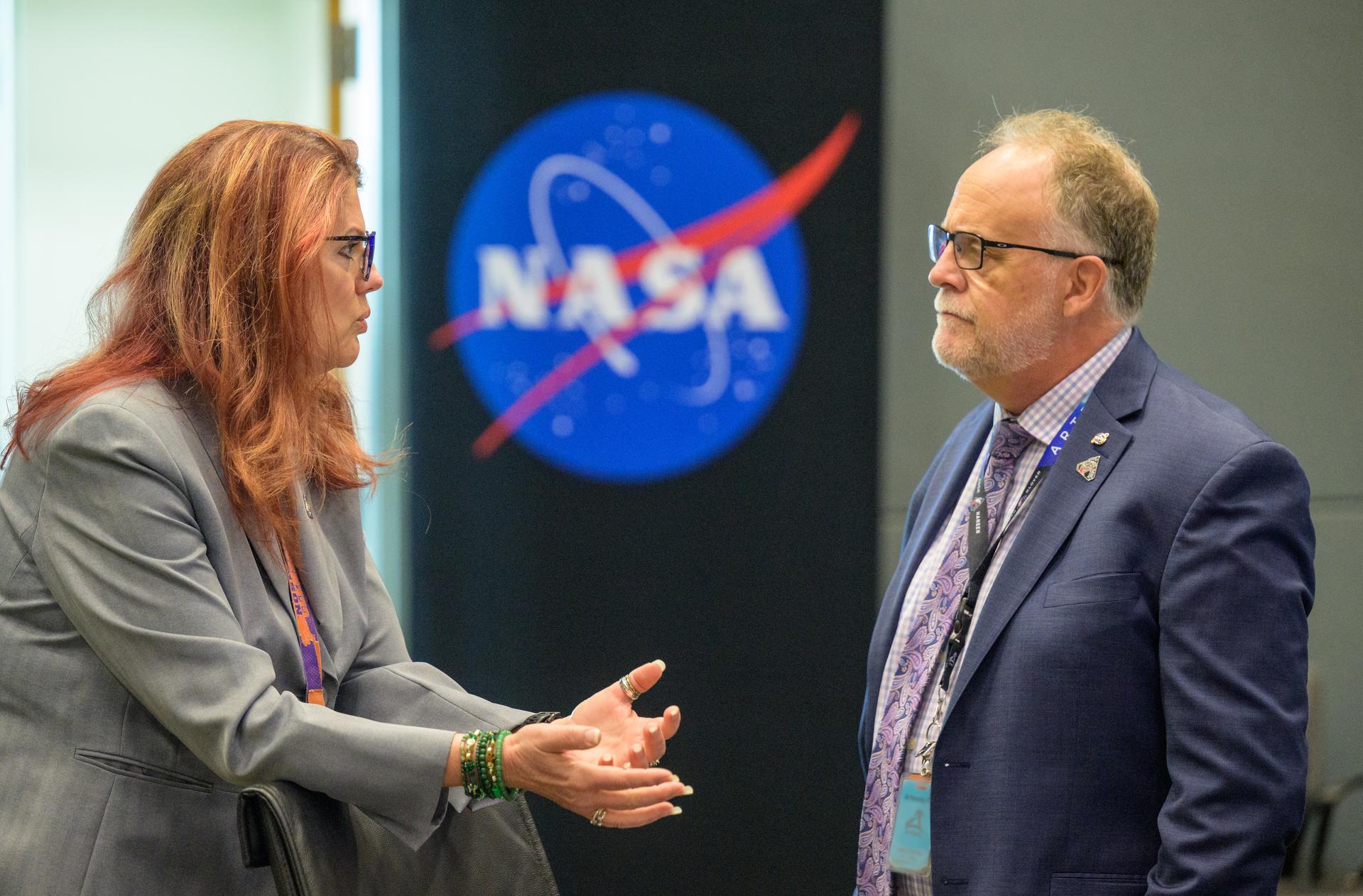 Charlie Blackwell-Thompson, Artemis II launch director, left, and speaks with Shawn Quinn, manager of Exploration Ground Systems, as they meet for the Artemis II launch countdown pre-test briefing, Saturday, March 28, 2026, at NASA’s Kennedy Space Center, Operations Support Building II in Florida. Photo Credit: (NASA/Bill Ingalls) NOTE - Portions of this image have been blurred for security reasons.