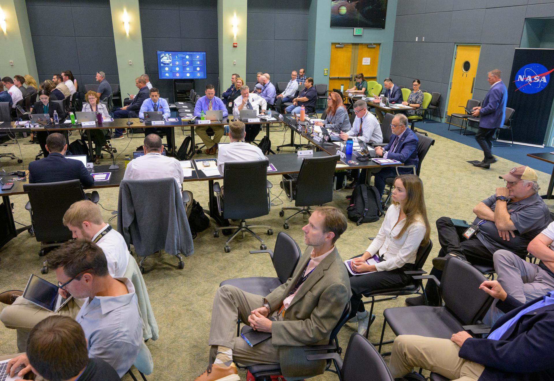 Teams at NASA’s Kennedy Space Center in Florida meet on Saturday, March 28, 2026, at the Operations Support Building II for the Artemis II launch countdown pre-test briefing. Photo Credit: (NASA/Bill Ingalls)