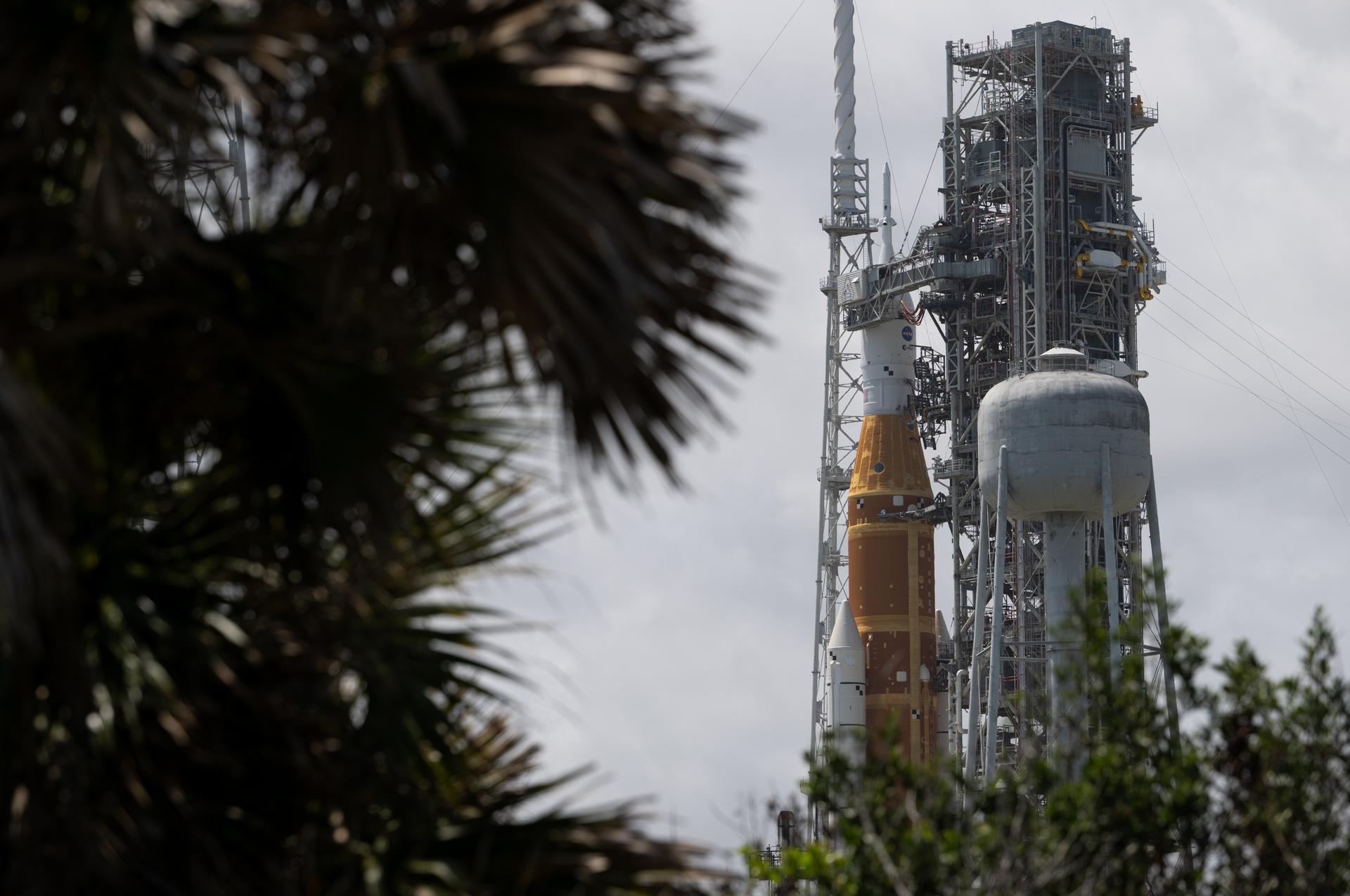 NASA’s Artemis II Space Launch System (SLS) rocket and Orion spacecraft are seen atop a mobile launcher at Launch Complex 39B, Monday, March 30, 2026, as preparations continue for launch at NASA’s Kennedy Space Center in Florida. NASA’s Artemis II test flight will take Commander Reid Wiseman, Pilot Victor Glover, and Mission Specialist Christina Koch from NASA, and Mission Specialist Jeremy Hansen from the CSA (Canadian Space Agency), around the Moon and back to Earth with launch opportunities beginning in April 2026. Photo Credit: (NASA/Joel Kowsky)