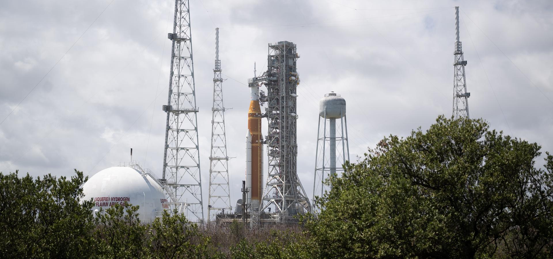 NASA’s Artemis II Space Launch System (SLS) rocket and Orion spacecraft are seen atop a mobile launcher at Launch Complex 39B, Monday, March 30, 2026, as preparations continue for launch at NASA’s Kennedy Space Center in Florida. NASA’s Artemis II test flight will take Commander Reid Wiseman, Pilot Victor Glover, and Mission Specialist Christina Koch from NASA, and Mission Specialist Jeremy Hansen from the CSA (Canadian Space Agency), around the Moon and back to Earth with launch opportunities beginning in April 2026. Photo Credit: (NASA/Joel Kowsky)