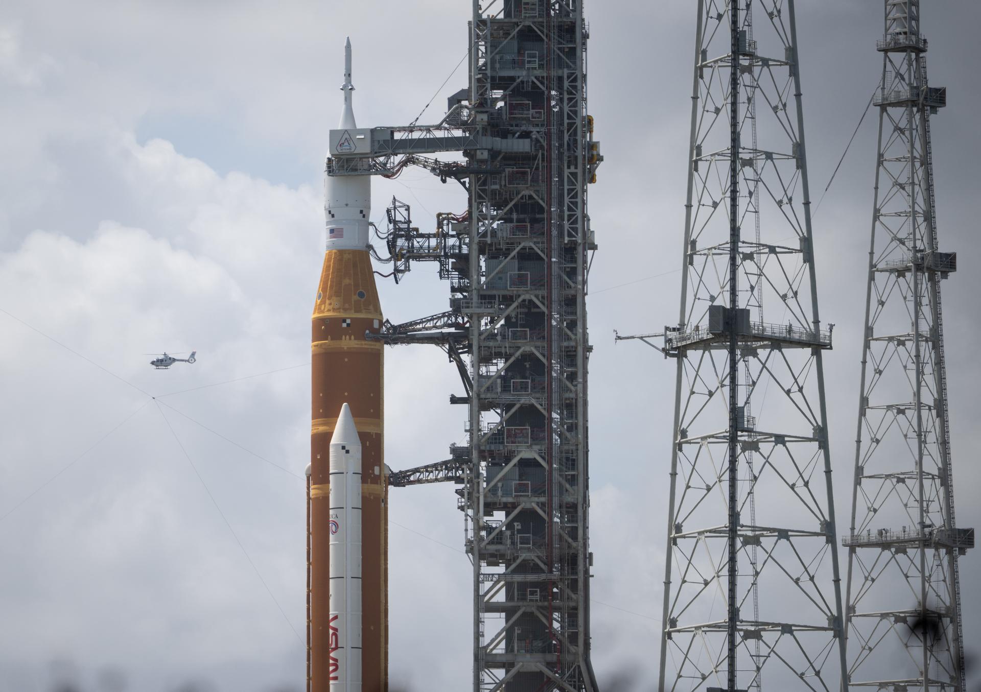 NASA’s Artemis II Space Launch System (SLS) rocket and Orion spacecraft are seen atop a mobile launcher at Launch Complex 39B, Monday, March 30, 2026, as preparations continue for launch at NASA’s Kennedy Space Center in Florida. NASA’s Artemis II test flight will take Commander Reid Wiseman, Pilot Victor Glover, and Mission Specialist Christina Koch from NASA, and Mission Specialist Jeremy Hansen from the CSA (Canadian Space Agency), around the Moon and back to Earth with launch opportunities beginning in April 2026. Photo Credit: (NASA/Joel Kowsky)