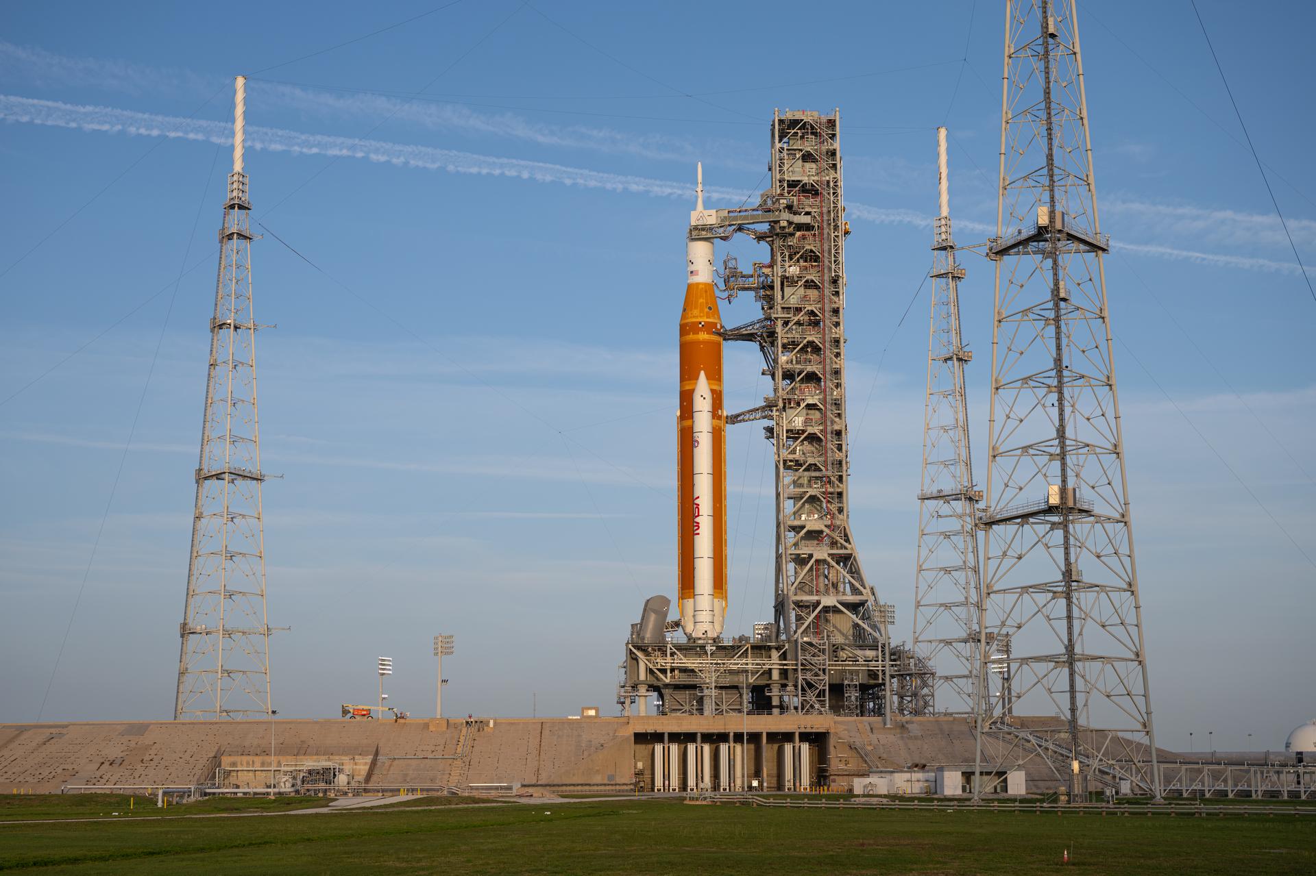 NASA’s Artemis II Space Launch System (SLS) rocket and Orion spacecraft are seen standing atop a mobile launcher at Launch Complex 39B, Tuesday, March 31, 2026, at NASA’s Kennedy Space Center in Florida. NASA’s Artemis II test flight will take Commander Reid Wiseman, Pilot Victor Glover, and Mission Specialist Christina Koch from NASA, and Mission Specialist Jeremy Hansen from the CSA (Canadian Space Agency), around the Moon and back to Earth no earlier than April 1, 2026. Photo Credit: (NASA/John Kraus)