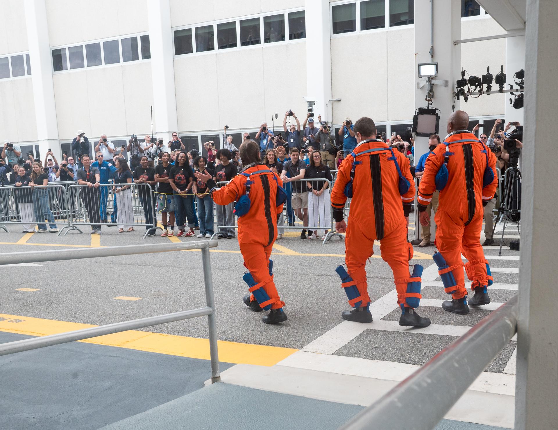From left to right, NASA astronauts Christina Koch, mission specialist, Reid Wiseman, commander; Victor Glover, pilot; and CSA (Canadian Space Agency) astronaut Jeremy Hansen, mission specialist, are seen as they depart the Neil A. Armstrong Operations and Checkout Building to board their Orion spacecraft atop NASA’s Space Launch System (SLS) rocket at Launch Complex 39B, Wednesday, April 1, 2026, at NASA’s Kennedy Space Center in Florida. NASA’s Artemis II mission will take Wiseman, Glover, Koch, and Hansen on a 10-day journey around the Moon and back aboard their Orion spacecraft from Launch Complex 39B, with a two hour launch window opening at 6:24pm. Photo Credit: (NASA/Aubrey Gemignani)