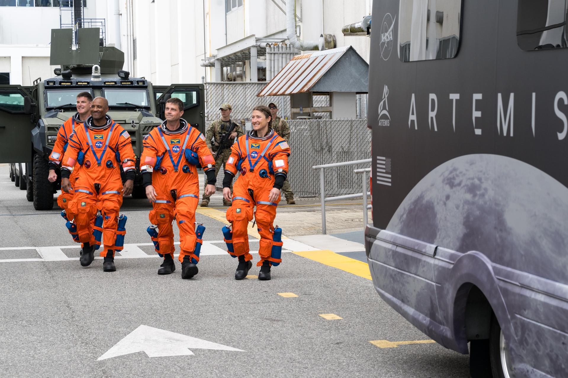 From right to left, NASA astronauts Christina Koch, mission specialist; Reid Wiseman, commander; Victor Glover, pilot; and CSA (Canadian Space Agency) astronaut Jeremy Hansen, mission specialist are seen as they depart the Neil A. Armstrong Operations and Checkout Building to board their Orion spacecraft atop NASA’s Space Launch System (SLS) rocket at Launch Complex 39B, Wednesday, April 1, 2026, at NASA’s Kennedy Space Center in Florida. NASA’s Artemis II mission will take Wiseman, Glover, Koch, and Hansen on a 10-day journey around the Moon and back aboard their Orion spacecraft from Launch Complex 39B,  with a two hour launch window opening at 6:24pm. Photo Credit: (NASA/Aubrey Gemignani)