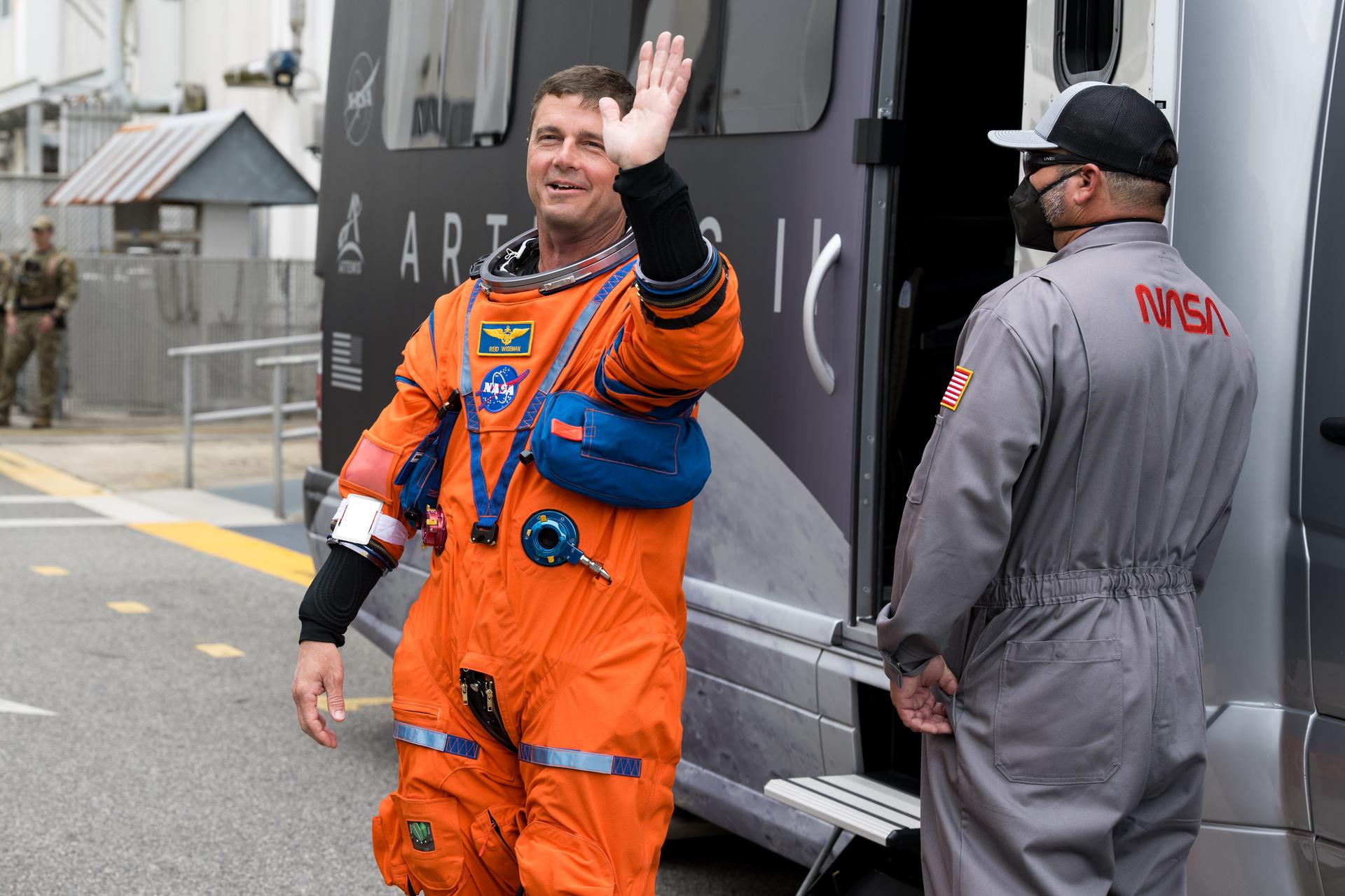 NASA astronaut Reid Wiseman, commander waves to family and friends as he and crew mates Victor Glover, pilot; Christina Koch, mission specialist; and CSA (Canadian Space Agency) astronaut Jeremy Hansen, mission specialist prepare to depart the Neil A. Armstrong Operations and Checkout Building to board their Orion spacecraft atop NASA’s Space Launch System (SLS) rocket at Launch Complex 39B, Wednesday, April 1, 2026, at NASA’s Kennedy Space Center in Florida. NASA’s Artemis II mission will take Wiseman, Glover, Koch, and Hansen on a 10-day journey around the Moon and back aboard their Orion spacecraft from Launch Complex 39B,  with a two hour launch window opening at 6:24pm. Photo Credit: (NASA/Aubrey Gemignani)