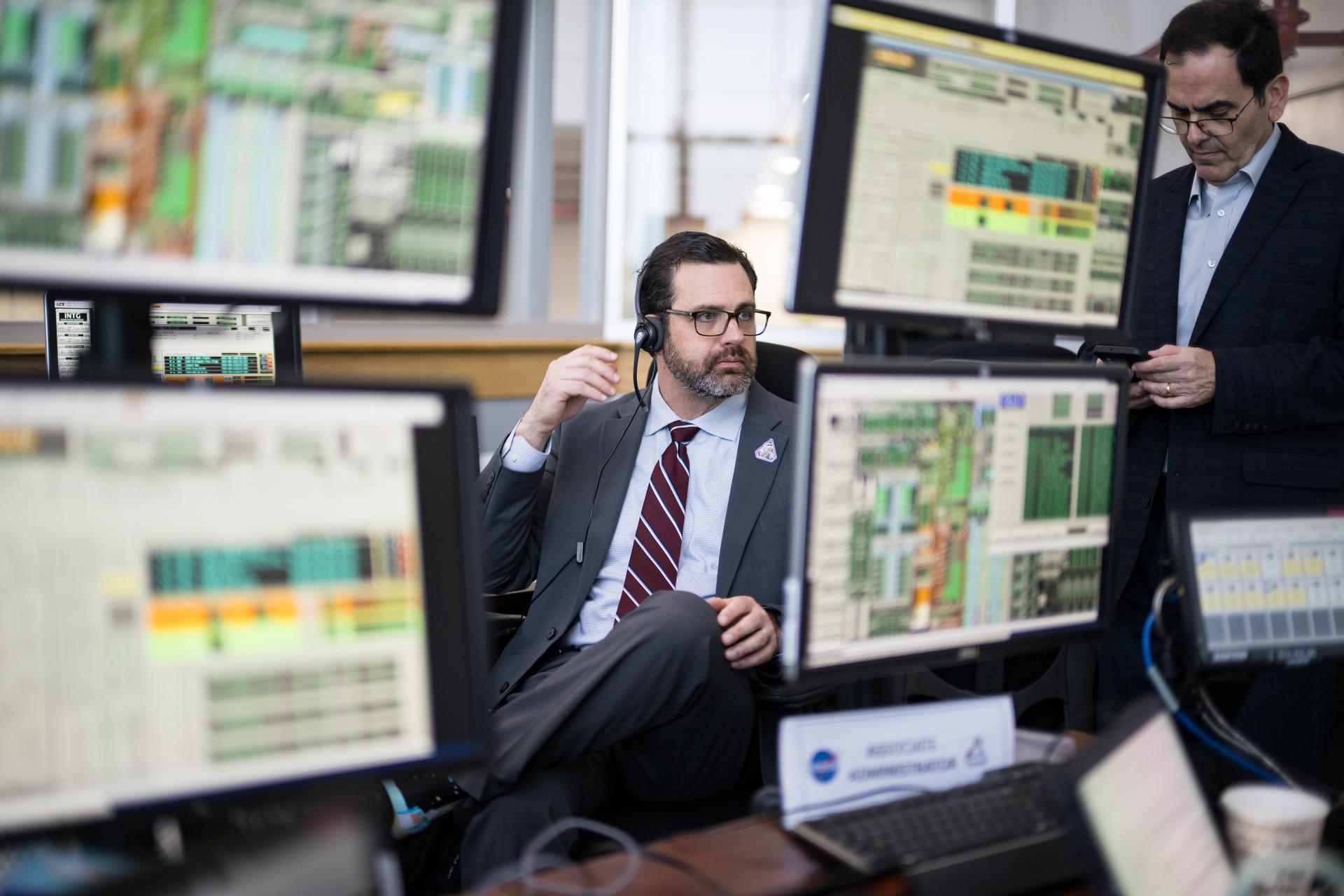 NASA Acting Deputy Associate Administrator for Moon to Mars, Jeremy Parsons, monitors the countdown of the launch of NASA’s Space Launch System (SLS) rocket and Orion spacecraft with NASA astronauts Reid Wiseman, commander; Victor Glover, pilot; Christina Koch, mission specialist; and CSA (Canadian Space Agency) astronaut Jeremy Hansen, mission specialist onboard on the Artemis II mission from Firing Room 2 of the Rocco A. Petrone Launch Control Center, Wednesday, April 1, 2026, at NASA’s Kennedy Space Center in Florida. NASA’s Artemis II mission will take Wiseman, Glover, Koch, and Hansen on a 10-day journey around the Moon and back aboard SLS rocket and Orion spacecraft from Launch Complex 39B. The quartet launched at 6:35pm EDT. Photo Credit: (NASA/Aubrey Gemignani)