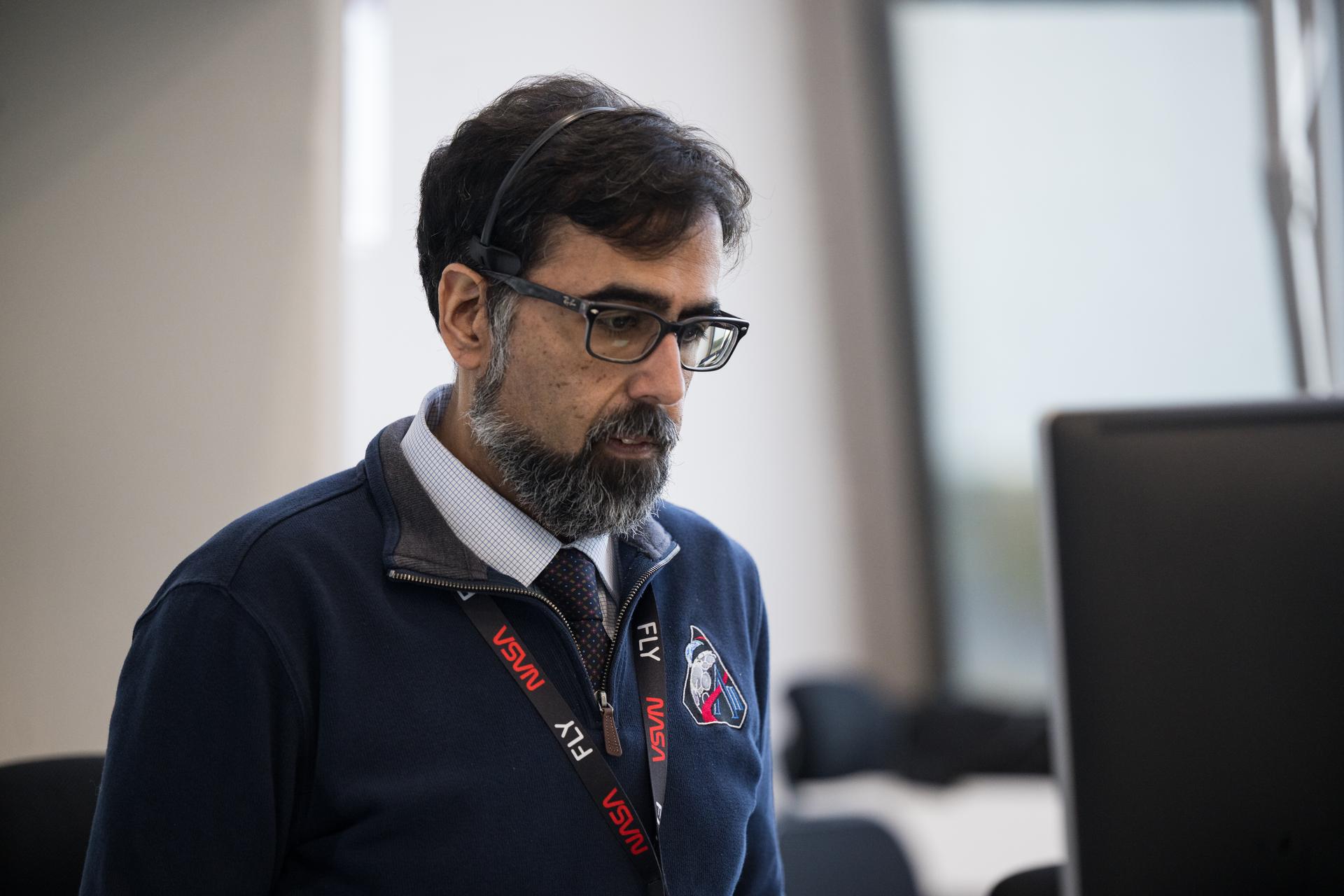 NASA Associate Administrator Amit Kshatriya monitors the countdown of the launch of NASA’s Space Launch System (SLS) rocket and Orion spacecraft with NASA astronauts Reid Wiseman, commander; Victor Glover, pilot; Christina Koch, mission specialist; and CSA (Canadian Space Agency) astronaut Jeremy Hansen, mission specialist onboard on the Artemis II mission from Firing Room 2 of the Rocco A. Petrone Launch Control Center, Wednesday, April 1, 2026, at NASA’s Kennedy Space Center in Florida. NASA’s Artemis II mission will take Wiseman, Glover, Koch, and Hansen on a 10-day journey around the Moon and back aboard SLS rocket and Orion spacecraft from Launch Complex 39B. The quartet launched at 6:35pm EDT. Photo Credit: (NASA/Aubrey Gemignani)