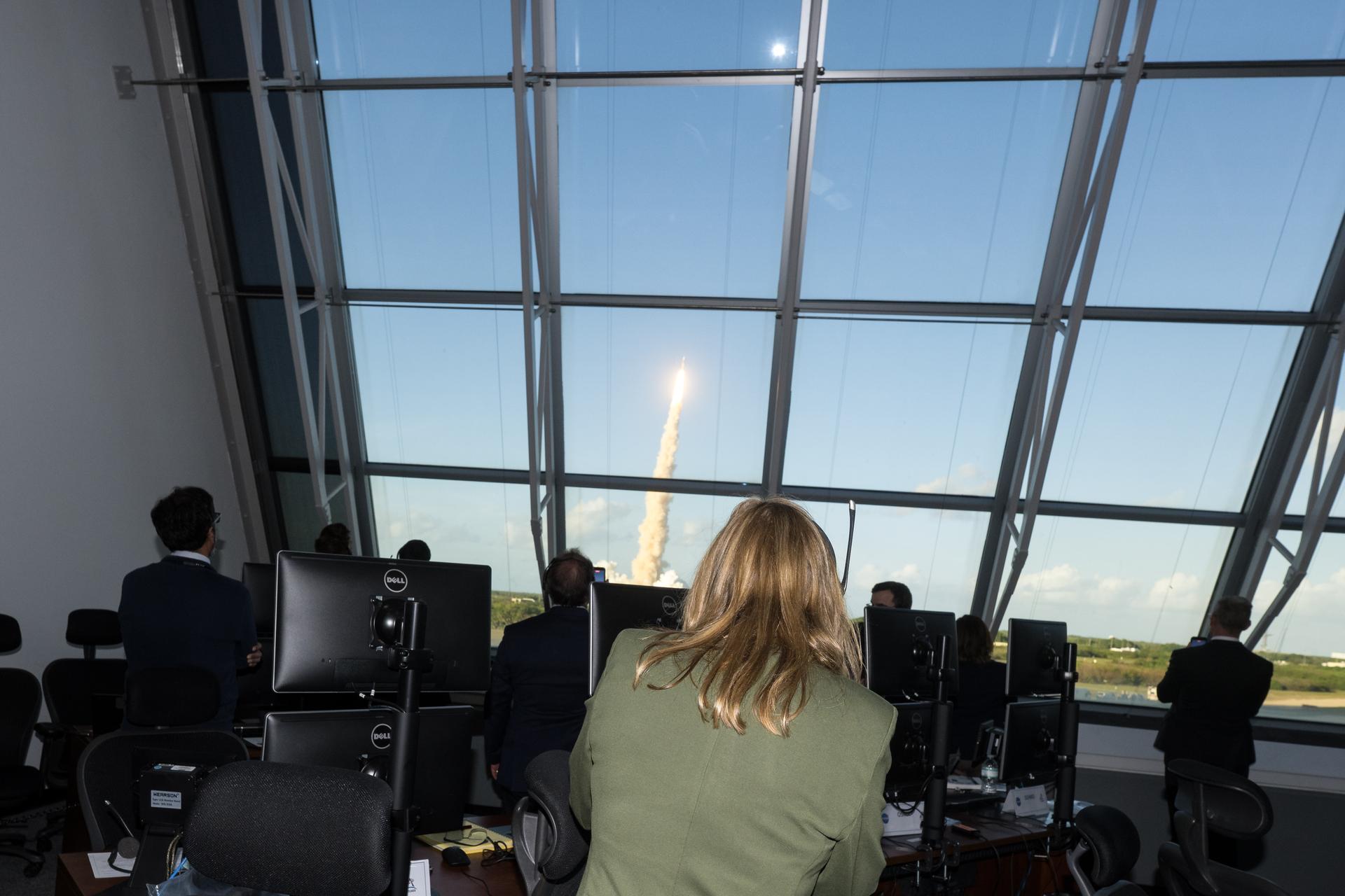 NASA Associate Administrator Amit Kshatriya, left, and Director of NASA's Kennedy Space Center, Janet Petro,  watch the launch of NASA’s Space Launch System (SLS) rocket and Orion spacecraft with NASA astronauts Reid Wiseman, commander; Victor Glover, pilot; Christina Koch, mission specialist; and CSA (Canadian Space Agency) astronaut Jeremy Hansen, mission specialist onboard on the Artemis II mission from Firing Room 2 of the Rocco A. Petrone Launch Control Center, Wednesday, April 1, 2026, at NASA’s Kennedy Space Center in Florida. NASA’s Artemis II mission will take Wiseman, Glover, Koch, and Hansen on a 10-day journey around the Moon and back aboard SLS rocket and Orion spacecraft from Launch Complex 39B. The quartet launched at 6:35pm EDT. Photo Credit: (NASA/Aubrey Gemignani)