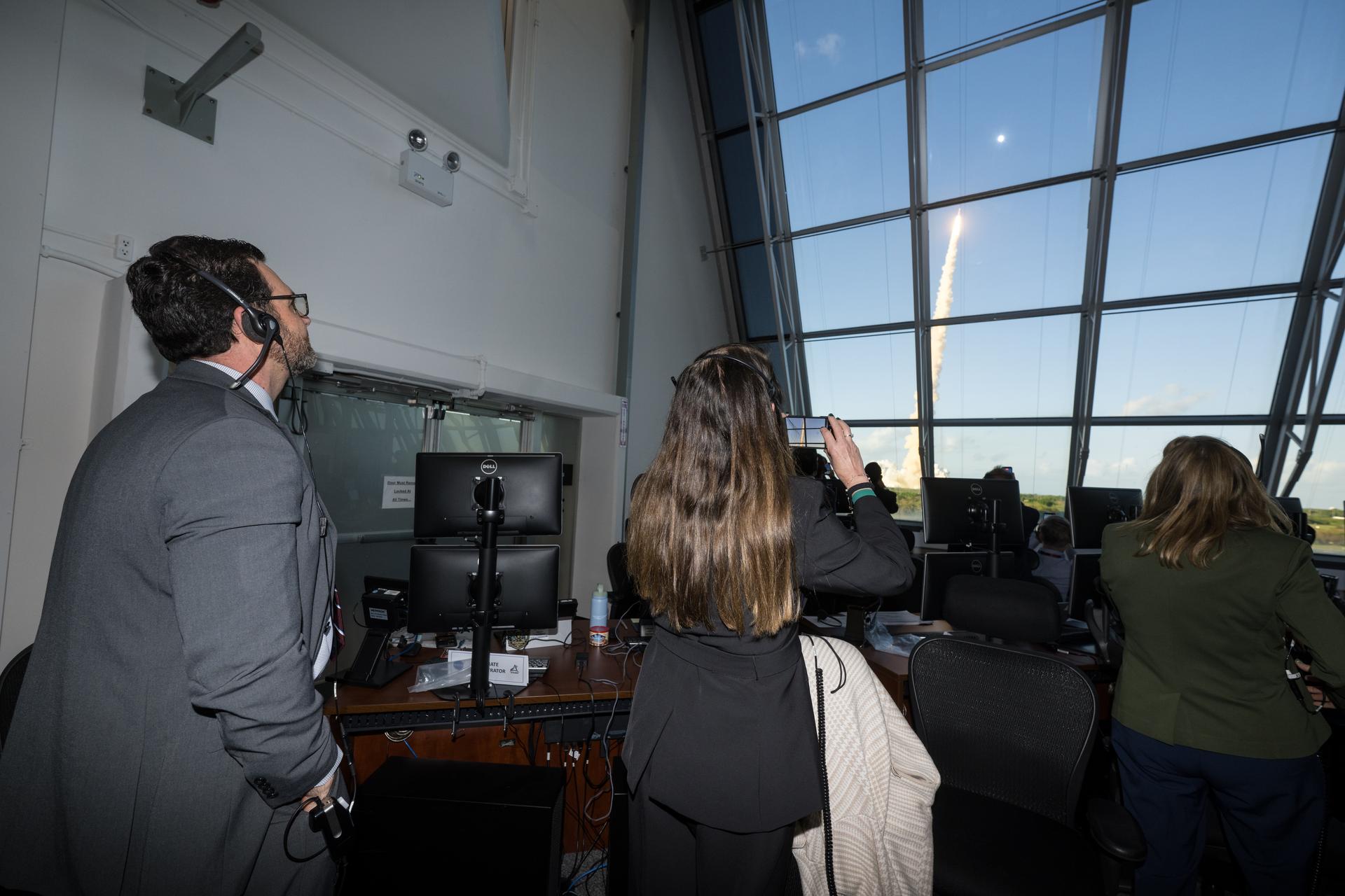 From left to right, NASA Acting Deputy Associate Administrator for Moon to Mars, Jeremy Parsons, Acting Director of NASA's Marshall Space Flight Center, Rae Ann Meyer, and Director of NASA's Kennedy Space Center, Janet Petro, watch the launch of NASA’s Space Launch System (SLS) rocket and Orion spacecraft with NASA astronauts Reid Wiseman, commander; Victor Glover, pilot; Christina Koch, mission specialist; and CSA (Canadian Space Agency) astronaut Jeremy Hansen, mission specialist onboard on the Artemis II mission from Firing Room 2 of the Rocco A. Petrone Launch Control Center, Wednesday, April 1, 2026, at NASA’s Kennedy Space Center in Florida. NASA’s Artemis II mission will take Wiseman, Glover, Koch, and Hansen on a 10-day journey around the Moon and back aboard SLS rocket and Orion spacecraft from Launch Complex 39B. The quartet launched at 6:35pm EDT. Photo Credit: (NASA/Aubrey Gemignani)