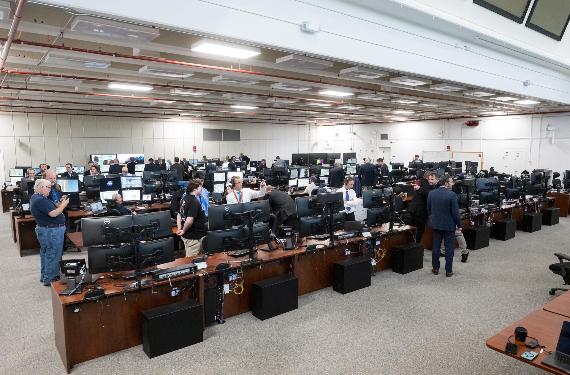 Teams celebrate after the launch of NASA’s Space Launch System (SLS) rocket and Orion spacecraft with NASA astronauts Reid Wiseman, commander; Victor Glover, pilot; Christina Koch, mission specialist; and CSA (Canadian Space Agency) astronaut Jeremy Hansen, mission specialist onboard the Artemis II mission in Firing Room 2 of the Rocco A. Petrone Launch Control Center, Wednesday, April 1, 2026, at NASA’s Kennedy Space Center in Florida. NASA’s Artemis II mission will take Wiseman, Glover, Koch, and Hansen on a 10-day journey around the Moon and back aboard SLS rocket and Orion spacecraft from Launch Complex 39B. The quartet launched at 6:35pm EDT. Photo Credit: (NASA/Aubrey Gemignani)
