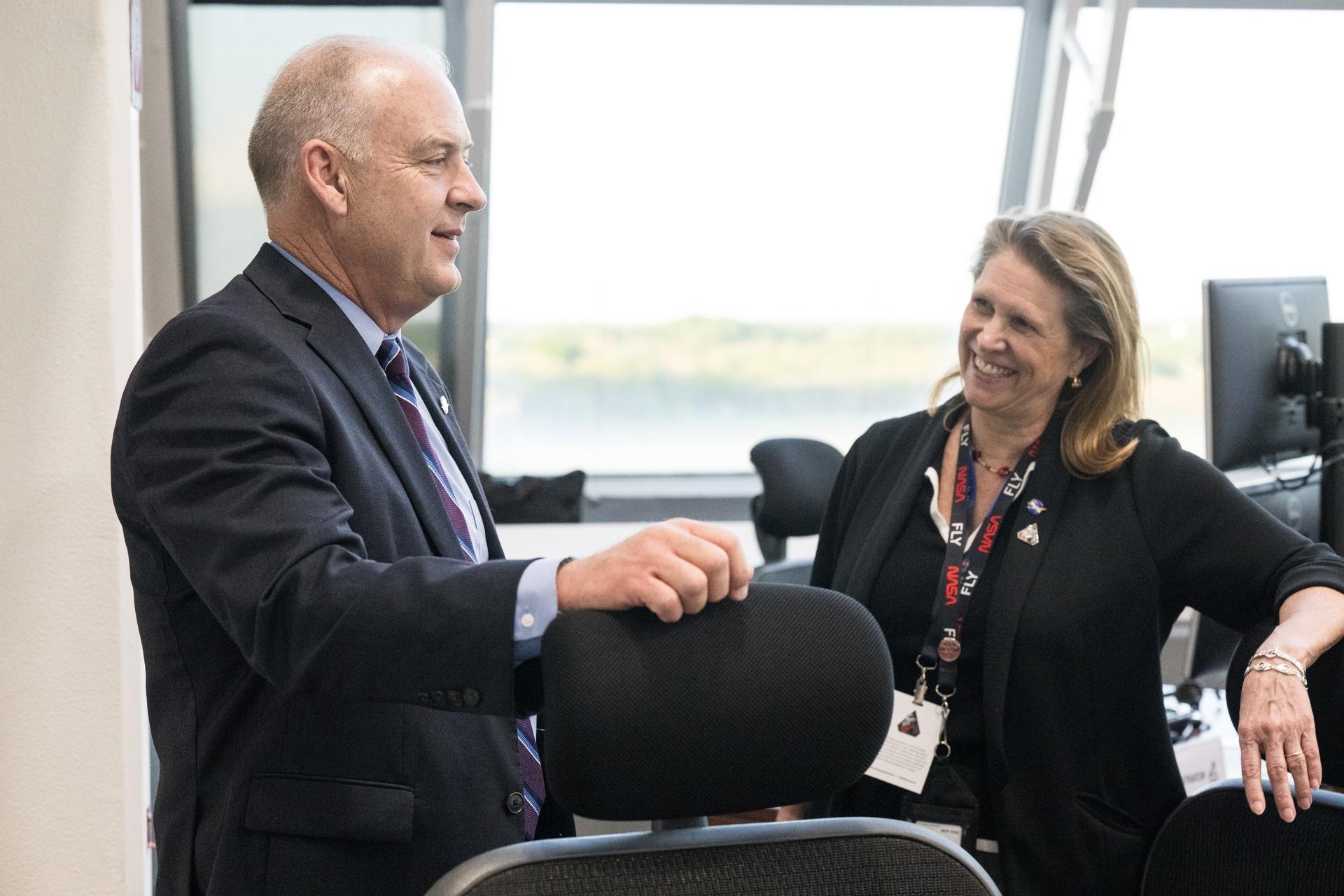 Director of Flight Operations at NASA's Johnson Space Center, Norm Knight, left, and Acting Associate Administrator for NASA's Exploration Systems Development Mission Directorate, Lori Glaze, speak after watching the launch of NASA’s Space Launch System (SLS) rocket and Orion spacecraft with NASA astronauts Reid Wiseman, commander; Victor Glover, pilot; Christina Koch, mission specialist; and CSA (Canadian Space Agency) astronaut Jeremy Hansen, mission specialist onboard on the Artemis II mission in Firing Room 2 of the Rocco A. Petrone Launch Control Center, Wednesday, April 1, 2026, at NASA’s Kennedy Space Center in Florida. NASA’s Artemis II mission will take Wiseman, Glover, Koch, and Hansen on a 10-day journey around the Moon and back aboard SLS rocket and Orion spacecraft from Launch Complex 39B. The quartet launched at 6:35pm EDT. Photo Credit: (NASA/Aubrey Gemignani)