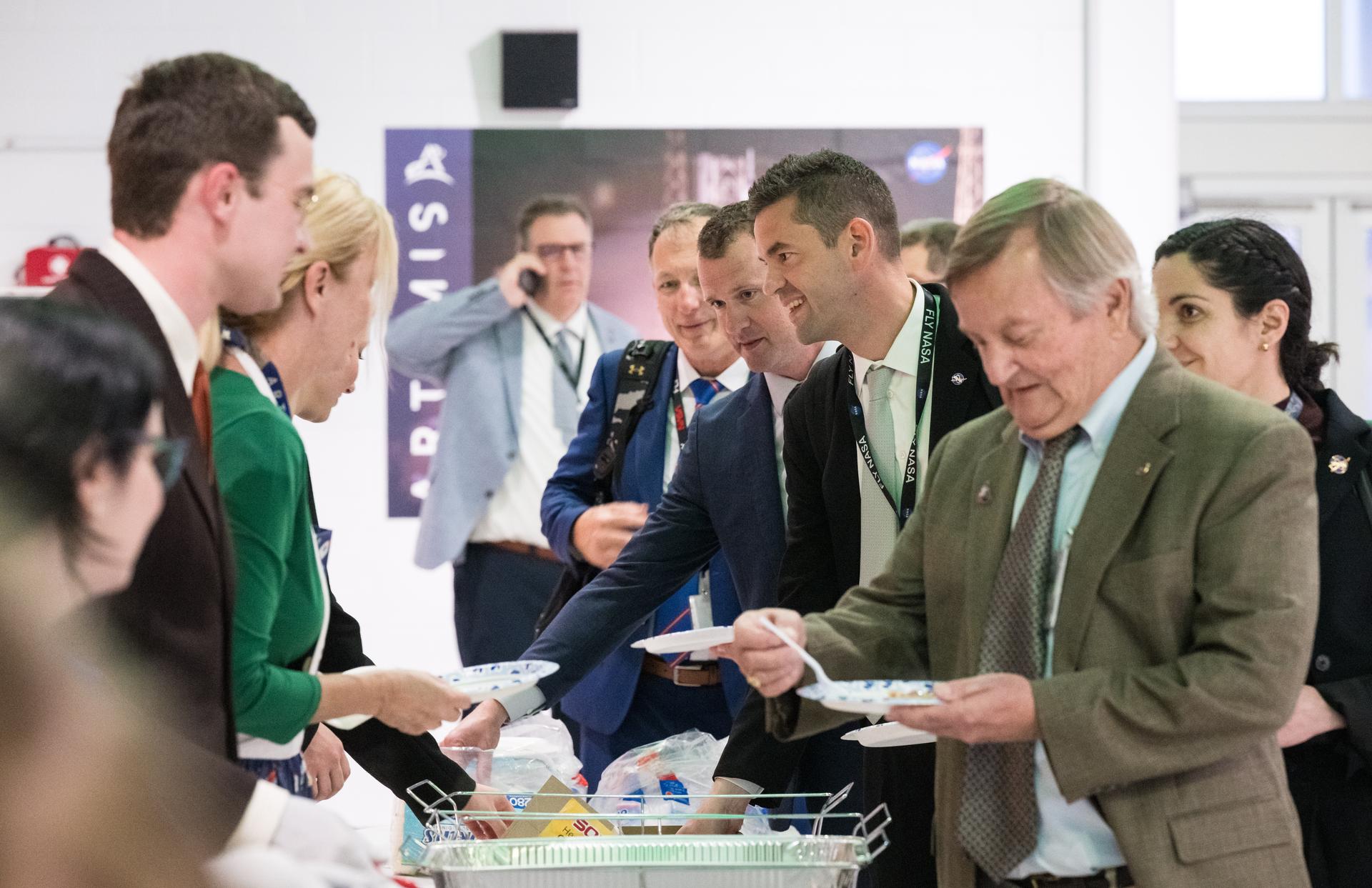 NASA Administrator Jared Isaacman participates in the beans and cornbread tradition after a successful launch of NASA’s Space Launch System (SLS) rocket and Orion spacecraft with NASA astronauts Reid Wiseman, commander; Victor Glover, pilot; Christina Koch, mission specialist; and CSA (Canadian Space Agency) astronaut Jeremy Hansen, mission specialist onboard on the Artemis II mission in Firing Room 2 of the Rocco A. Petrone Launch Control Center, Wednesday, April 1, 2026, at NASA’s Kennedy Space Center in Florida. NASA’s Artemis II mission will take Wiseman, Glover, Koch, and Hansen on a 10-day journey around the Moon and back aboard the SLS rocket and Orion spacecraft. The quartet launched at 6:35pm EDT. Photo Credit: (NASA/Aubrey Gemignani)