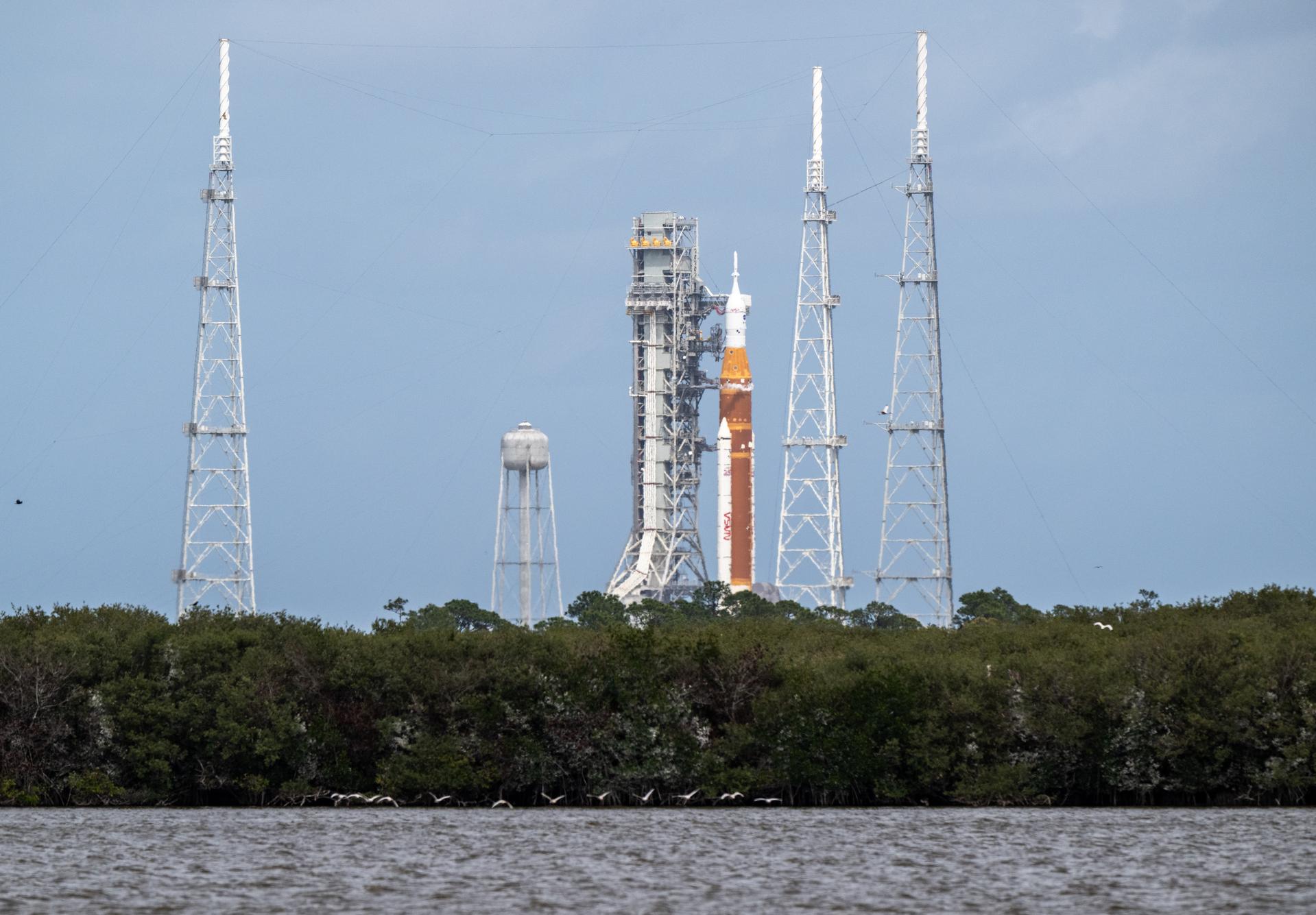 NASA’s Space Launch System (SLS) rocket with the Orion spacecraft aboard is seen atop the mobile launcher at Launch Complex 39B, Wednesday, April 1, 2026, as the launch countdown progresses at NASA’s Kennedy Space Center in Florida. NASA’s Artemis II mission will take NASA astronauts Reid Wiseman, commander; Victor Glover, pilot; Christina Koch, mission specialist; and CSA (Canadian Space Agency) astronaut Jeremy Hansen, mission specialist on a 10-day journey around the Moon and back aboard SLS rocket and Orion spacecraft from Launch Complex 39B, with a two hour launch window opening at 6:24 p.m. EDT.  Photo Credit: (NASA/Keegan Barber)