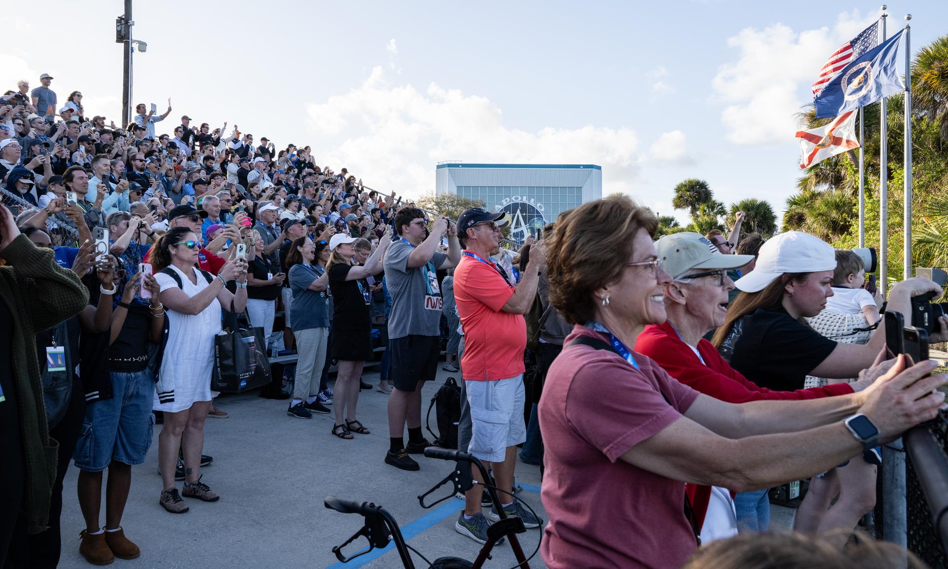 Guests at the Banana Creek viewing site watch the launch of NASA’s Space Launch System (SLS) rocket and Orion spacecraft with Commander Reid Wiseman, Pilot Victor Glover, and Mission Specialist Christina Koch from NASA, and Mission Specialist Jeremy Hansen from the CSA (Canadian Space Agency) on the Artemis II mission, Wednesday, April 1, 2026, at NASA’s Kennedy Space Center in Florida. NASA’s Artemis II mission will take Wiseman, Glover, Koch, and Hansen on a 10-day journey around the Moon and back aboard SLS rocket and Orion spacecraft. The quartet launched at 6:35 p.m. EDT from Launch Complex 39B. Photo Credit: (NASA/Keegan Barber)
