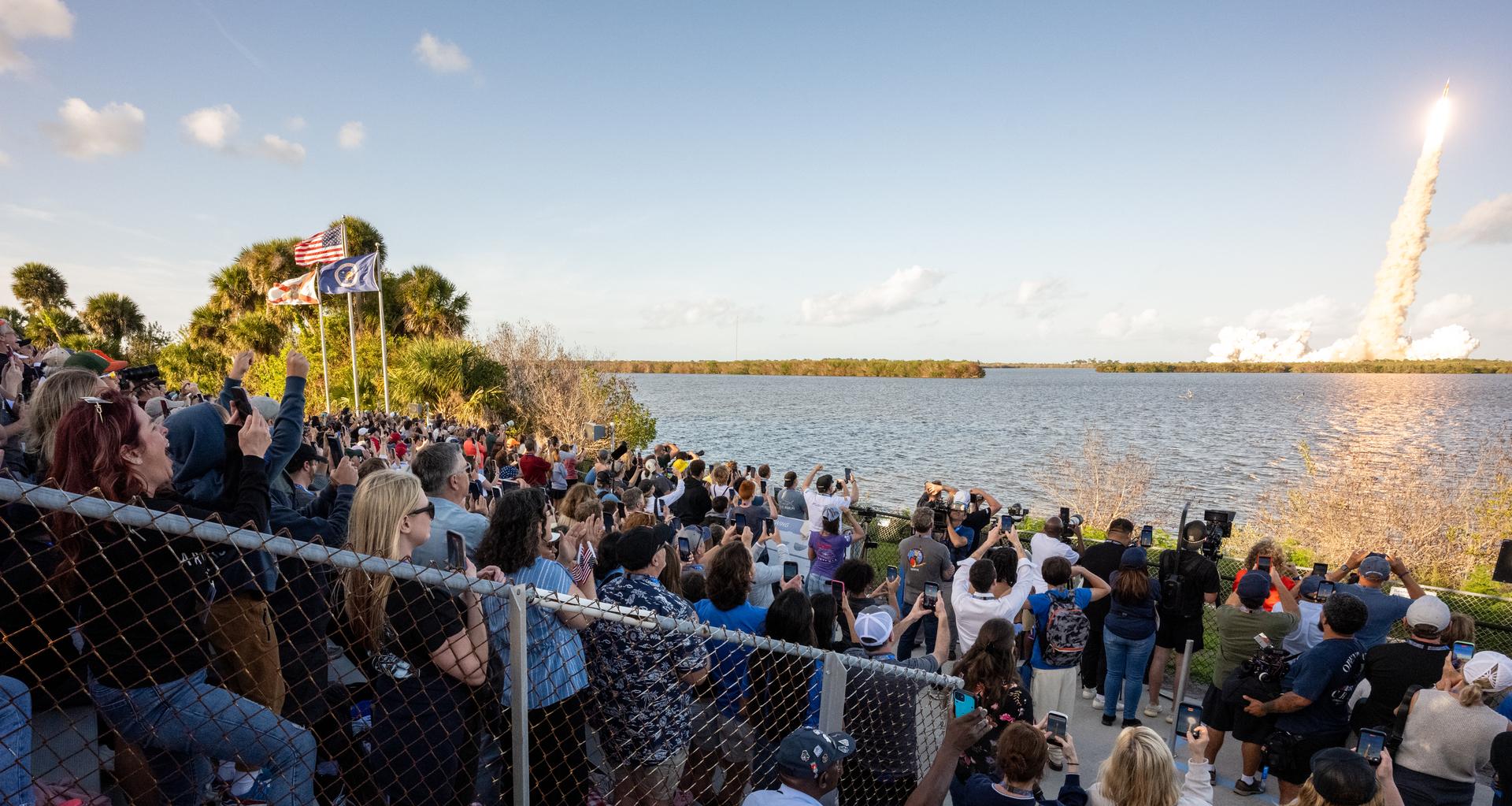 Guests at the Banana Creek viewing site watch the launch of NASA’s Space Launch System (SLS) rocket and Orion spacecraft with Commander Reid Wiseman, Pilot Victor Glover, and Mission Specialist Christina Koch from NASA, and Mission Specialist Jeremy Hansen from the CSA (Canadian Space Agency) on the Artemis II mission, Wednesday, April 1, 2026, at NASA’s Kennedy Space Center in Florida. NASA’s Artemis II mission will take Wiseman, Glover, Koch, and Hansen on a 10-day journey around the Moon and back aboard SLS rocket and Orion spacecraft. The quartet launched at 6:35 p.m. EDT from Launch Complex 39B. Photo Credit: (NASA/Keegan Barber)