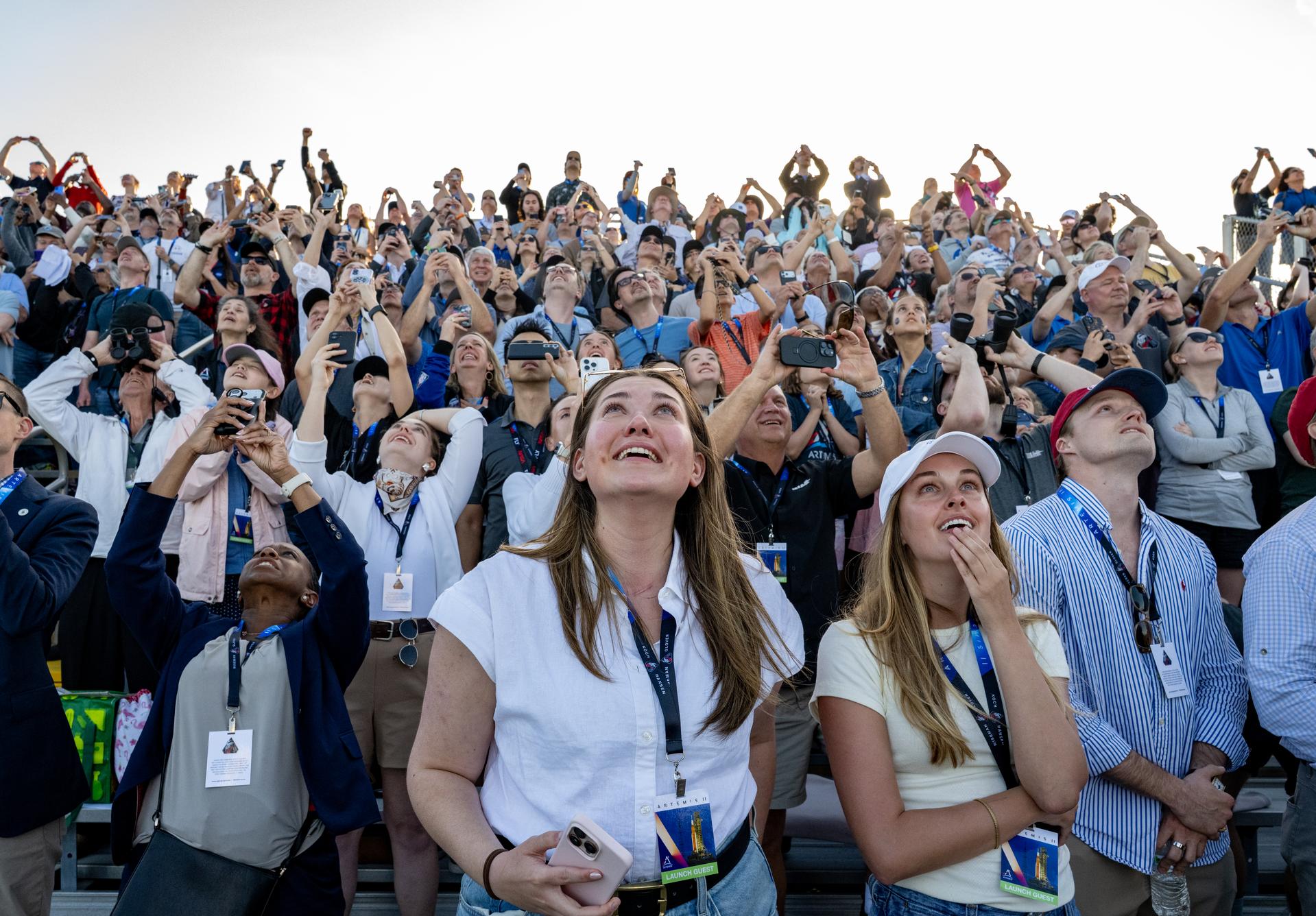 Guests at the Banana Creek viewing site watch the launch of NASA’s Space Launch System (SLS) rocket and Orion spacecraft with Commander Reid Wiseman, Pilot Victor Glover, and Mission Specialist Christina Koch from NASA, and Mission Specialist Jeremy Hansen from the CSA (Canadian Space Agency) on the Artemis II mission, Wednesday, April 1, 2026, at NASA’s Kennedy Space Center in Florida. NASA’s Artemis II mission will take Wiseman, Glover, Koch, and Hansen on a 10-day journey around the Moon and back aboard SLS rocket and Orion spacecraft. The quartet launched at 6:35 p.m. EDT from Launch Complex 39B. Photo Credit: (NASA/Keegan Barber)