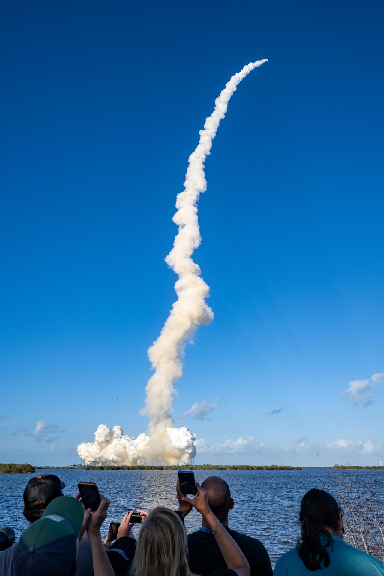 Guests at the Banana Creek viewing site watch the launch of NASA’s Space Launch System (SLS) rocket and Orion spacecraft with Commander Reid Wiseman, Pilot Victor Glover, and Mission Specialist Christina Koch from NASA, and Mission Specialist Jeremy Hansen from the CSA (Canadian Space Agency) on the Artemis II mission, Wednesday, April 1, 2026, at NASA’s Kennedy Space Center in Florida. NASA’s Artemis II mission will take Wiseman, Glover, Koch, and Hansen on a 10-day journey around the Moon and back aboard SLS rocket and Orion spacecraft. The quartet launched at 6:35 p.m. EDT from Launch Complex 39B. Photo Credit: (NASA/Keegan Barber)