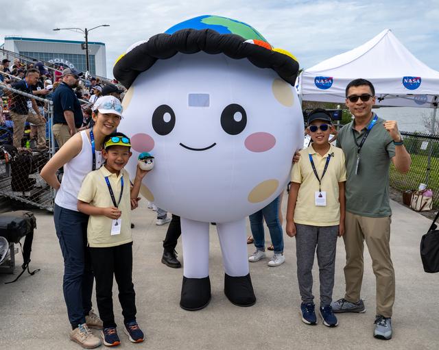 Lucas Ye, designer of zero gravity indicator “Rise,” and his family pose for ...