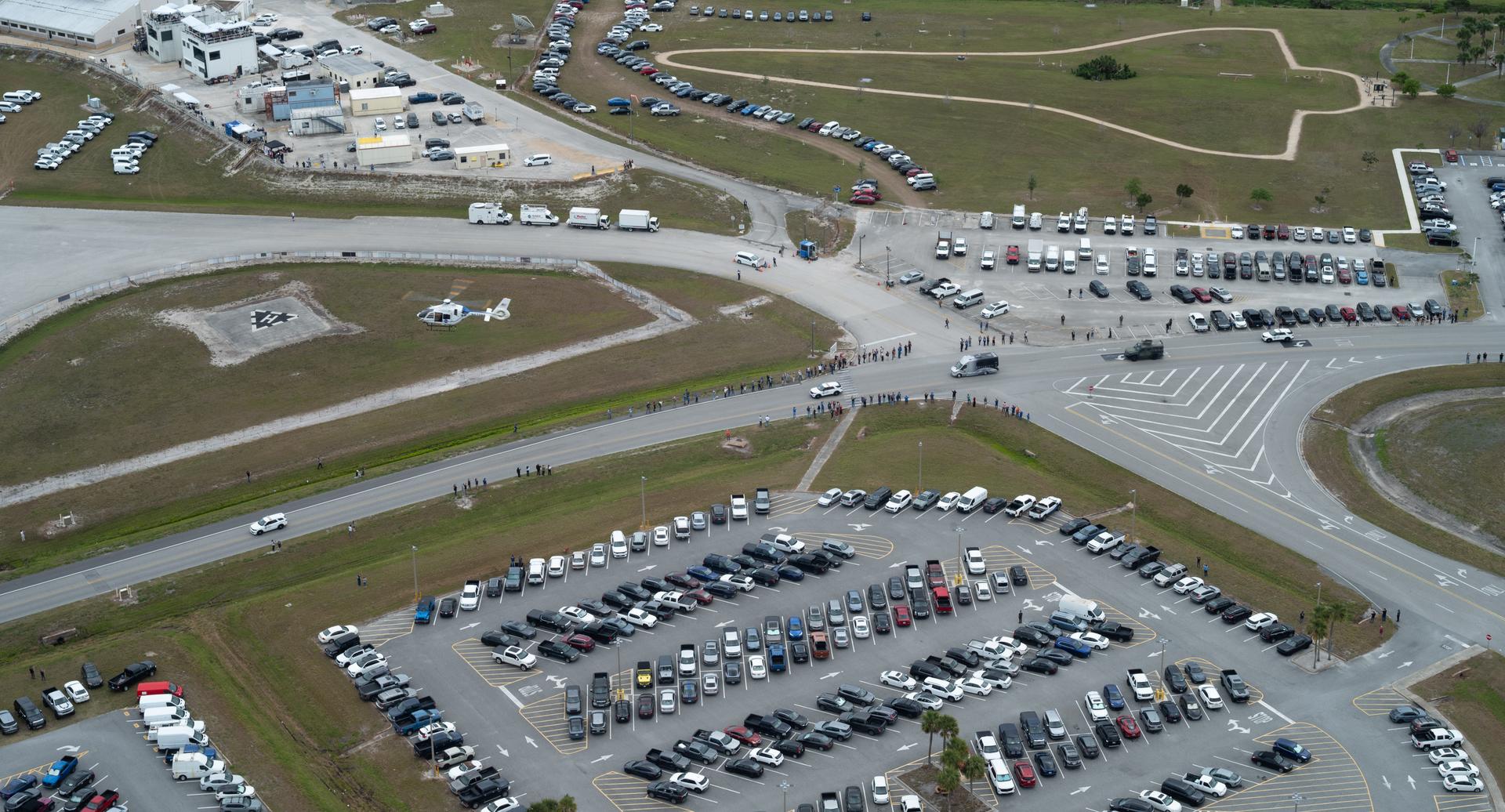 The astrovan with NASA astronauts Reid Wiseman, commander; Victor Glover, pilot; Christina Koch, mission specialist; and CSA (Canadian Space Agency) astronaut Jeremy Hansen, mission specialist, drives by the Vehicle Assembly Building towards Launch Complex 39B ahead of the crew boarding their Orion spacecraft atop NASA’s Space Launch System (SLS) rocket, Wednesday, April 1, 2026, at NASA’s Kennedy Space Center in Florida. NASA’s Artemis II mission will take Wiseman, Glover, Koch, and Hansen on a 10-day journey around the Moon and back aboard SLS rocket and Orion spacecraft from Launch Complex 39B, with a two hour launch window opening at 6:24 p.m. EDT.  Photo Credit: (NASA/Joel Kowsky)