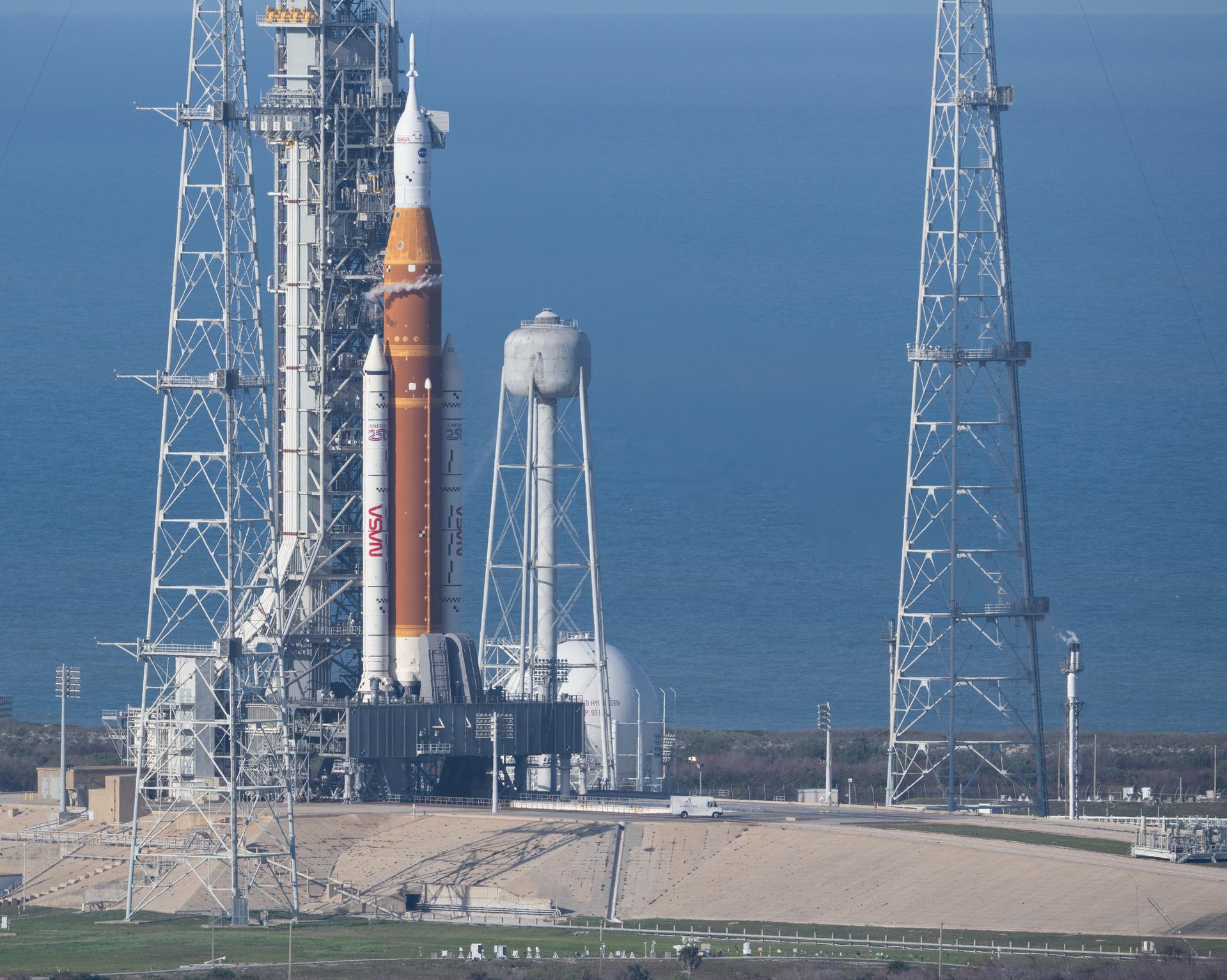 The closeout crew departs the launch pad after completing final configuration tasks and assisting NASA astronauts Reid Wiseman, commander; Victor Glover, pilot; Christina Koch, mission specialist; and CSA (Canadian Space Agency) astronaut Jeremy Hansen, mission specialist with boarding their Orion spacecraft atop NASA’s Space Launch System (SLS) rocket atop the mobile launcher at Launch Complex 39B, Wednesday, April 1, 2026, as the launch countdown progresses at NASA’s Kennedy Space Center in Florida. NASA’s Artemis II mission will take Wiseman, Glover, Koch, and Hansen on a 10-day journey around the Moon and back aboard SLS rocket and Orion spacecraft from Launch Complex 39B, with a two hour launch window opening at 6:24 p.m. EDT.  Photo Credit: (NASA/Joel Kowsky)