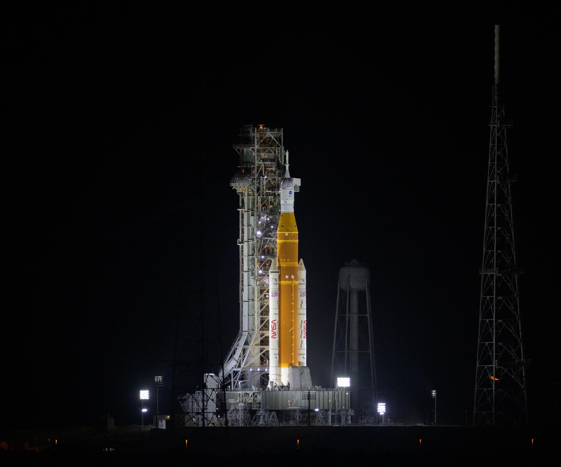 NASA’s Artemis II Space Launch System (SLS) rocket and Orion spacecraft are seen atop a mobile launcher at Launch Complex 39B, Wednesday, April 1, 2026, at NASA’s Kennedy Space Center in Florida. NASA’s Artemis II test flight will take Commander Reid Wiseman, Pilot Victor Glover, and Mission Specialist Christina Koch from NASA, and Mission Specialist Jeremy Hansen from the CSA (Canadian Space Agency), around the Moon and back to Earth. Photo Credit: (NASA/Bill Ingalls)